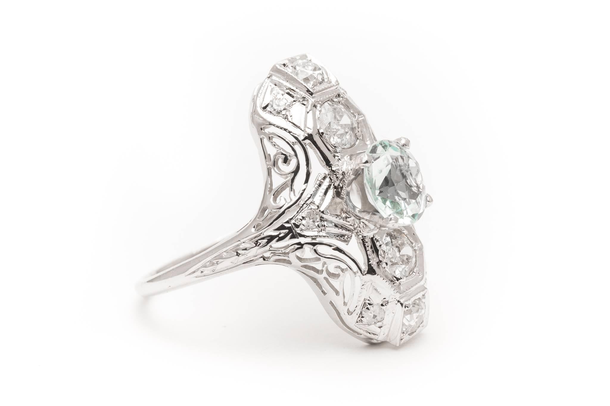 Beacon Hill Jewelers Presents:

A beautiful art deco period diamond and aquamarine ring in 18 karat white gold.  Centered by a high quality 1 carat natural Sky Blue aquamarine, this ring features a total of 0.92 carats of antique European cut