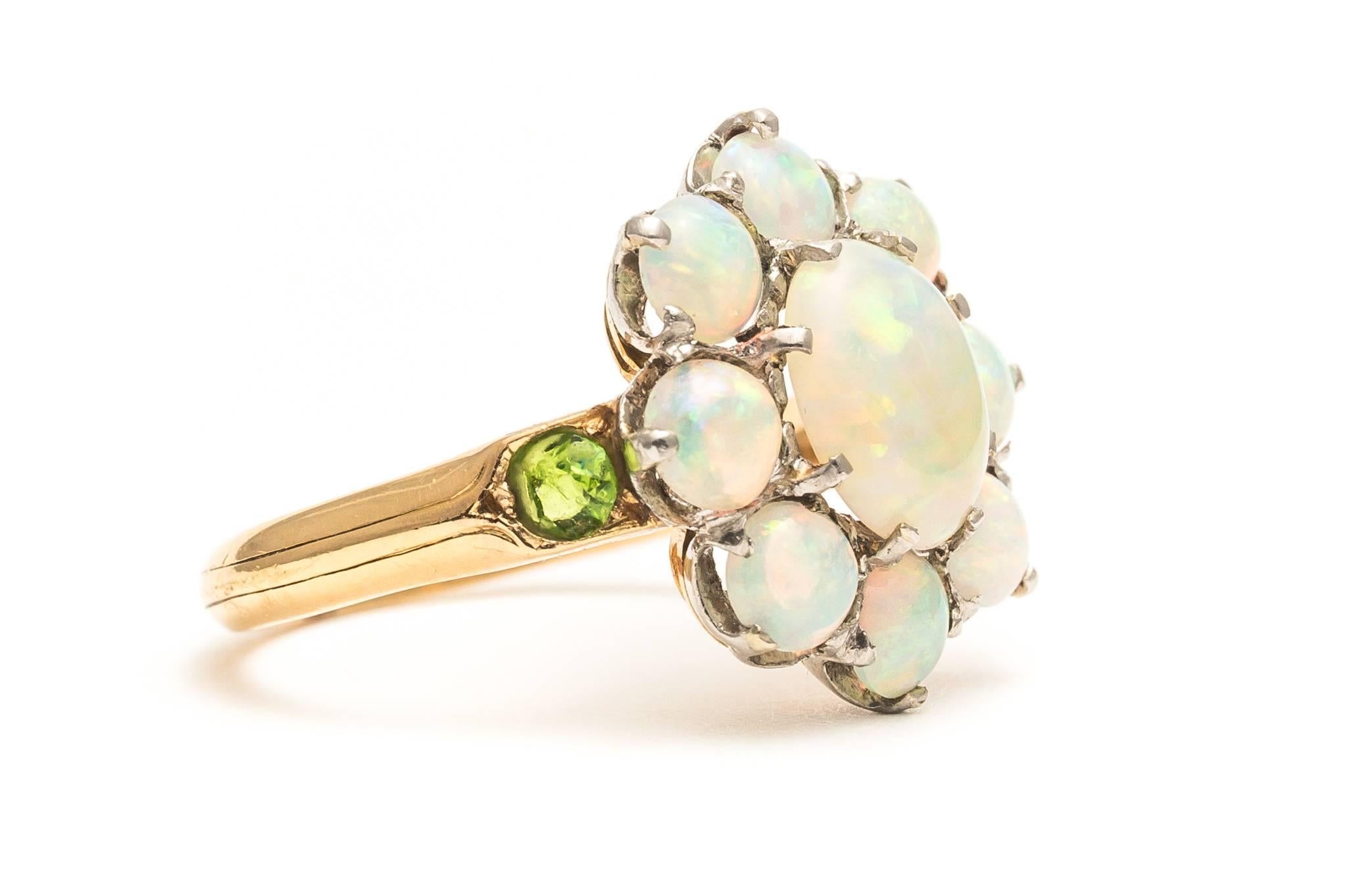 Beacon Hill Jewelers Presents:  

An original antique edwardian period opal, and demantoid garnet ring in platinum, and 18 karat yellow gold.  Set with stunning vividly colored lightning ridge opals who's color we cannot even being to capture in