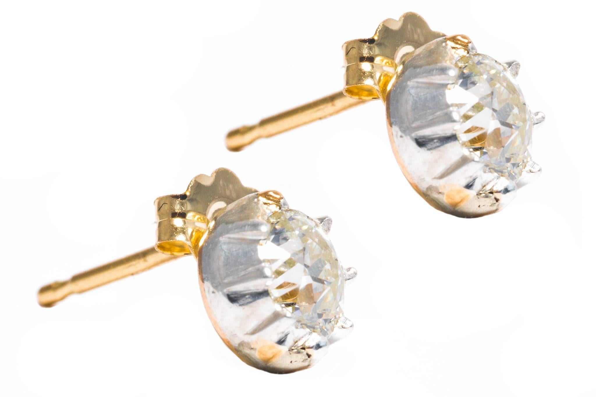Beacon Hill Jewelers Presents:

A pair of  diamond stud earrings in silver and yellow gold. Crafted of a silver top mated to a backing of yellow gold as is traditional of the georgian period, these earrings boast a pair of high quality antique mine