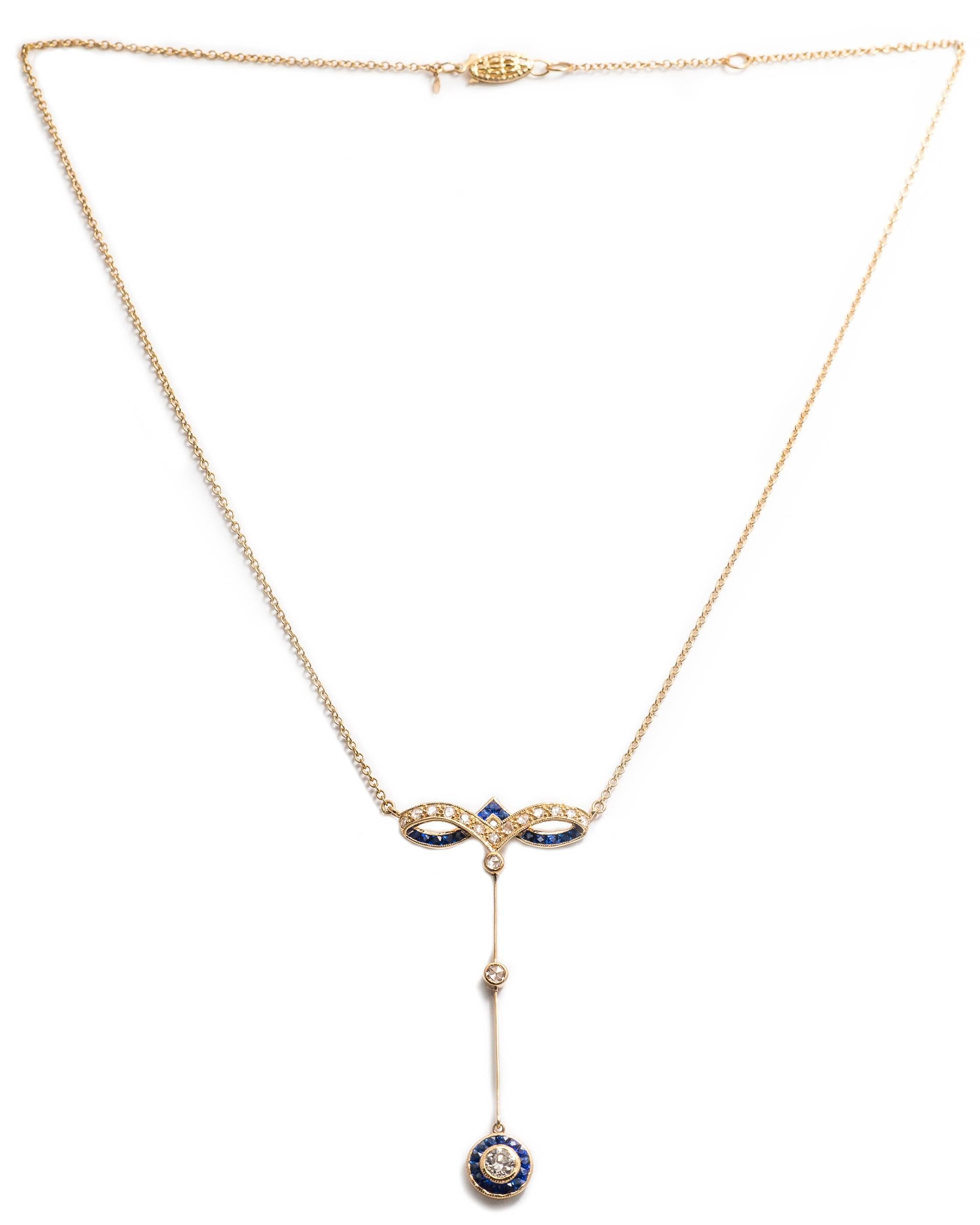 A beautiful yellow gold, sapphire and diamond necklace.  Featuring pave set rose cut and a bezel set European cut diamonds, this necklace also features beautiful rich vivid French cut blue sapphires.

Grading as beautiful VS clarity and H color, the