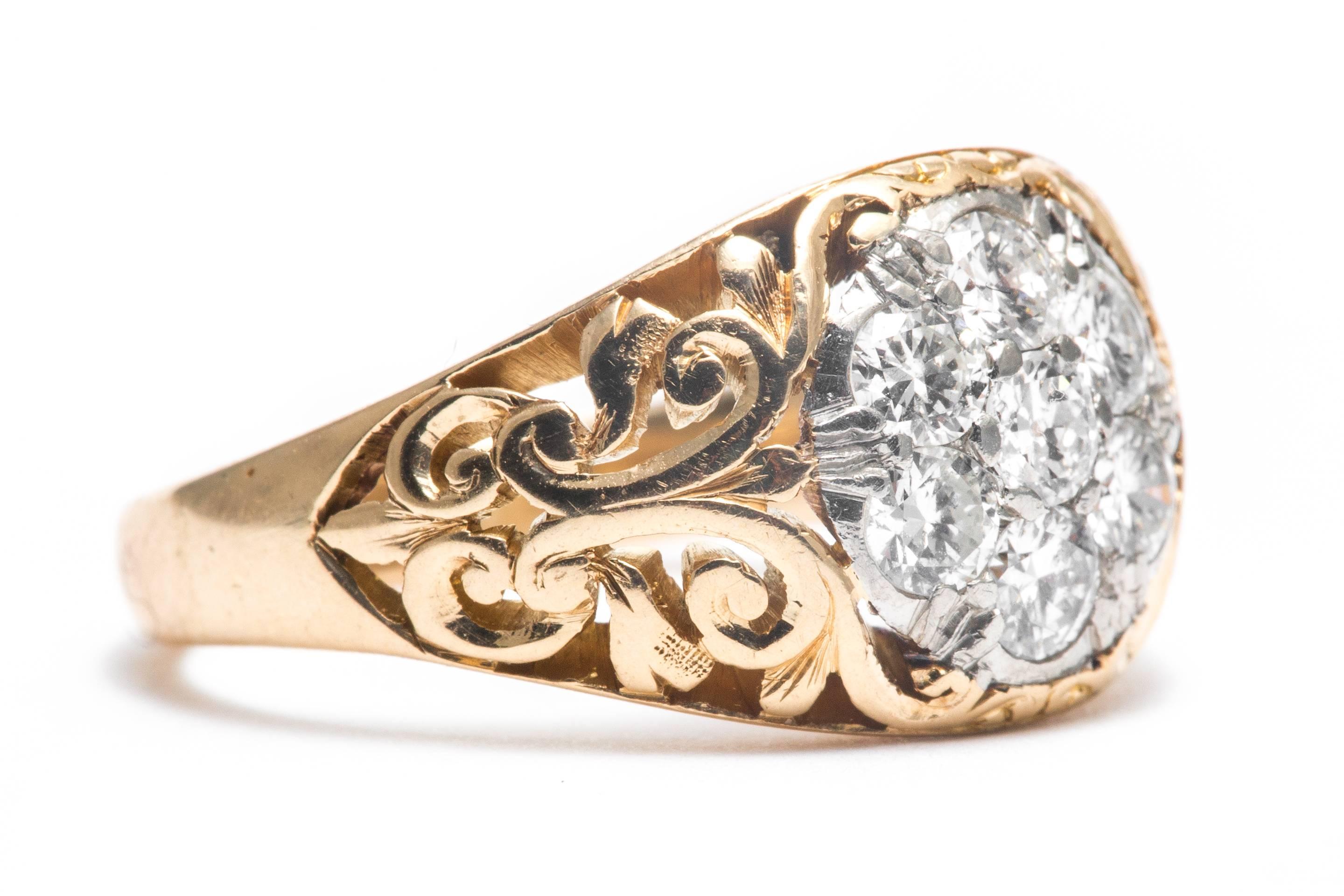 Beacon Hill Jewelers Presents:

An original art nouveau period scroll form diamond cluster ring in platinum and 14 karat yellow gold.  Set with a total of seven antique European cut diamonds weighing a combined 0.70 carats this ring features a