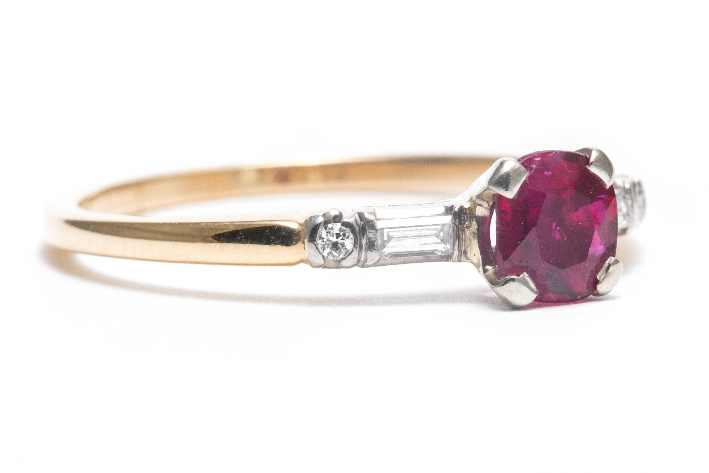 Beacon Hill Jewelers Presents:

A vintage mid 20th century ruby, and diamond ring in platinum and 14 karat yellow gold.  Centered by a high quality rich vivid red colored ruby, this ring also features a pair of beautiful baguette and Swiss cut
