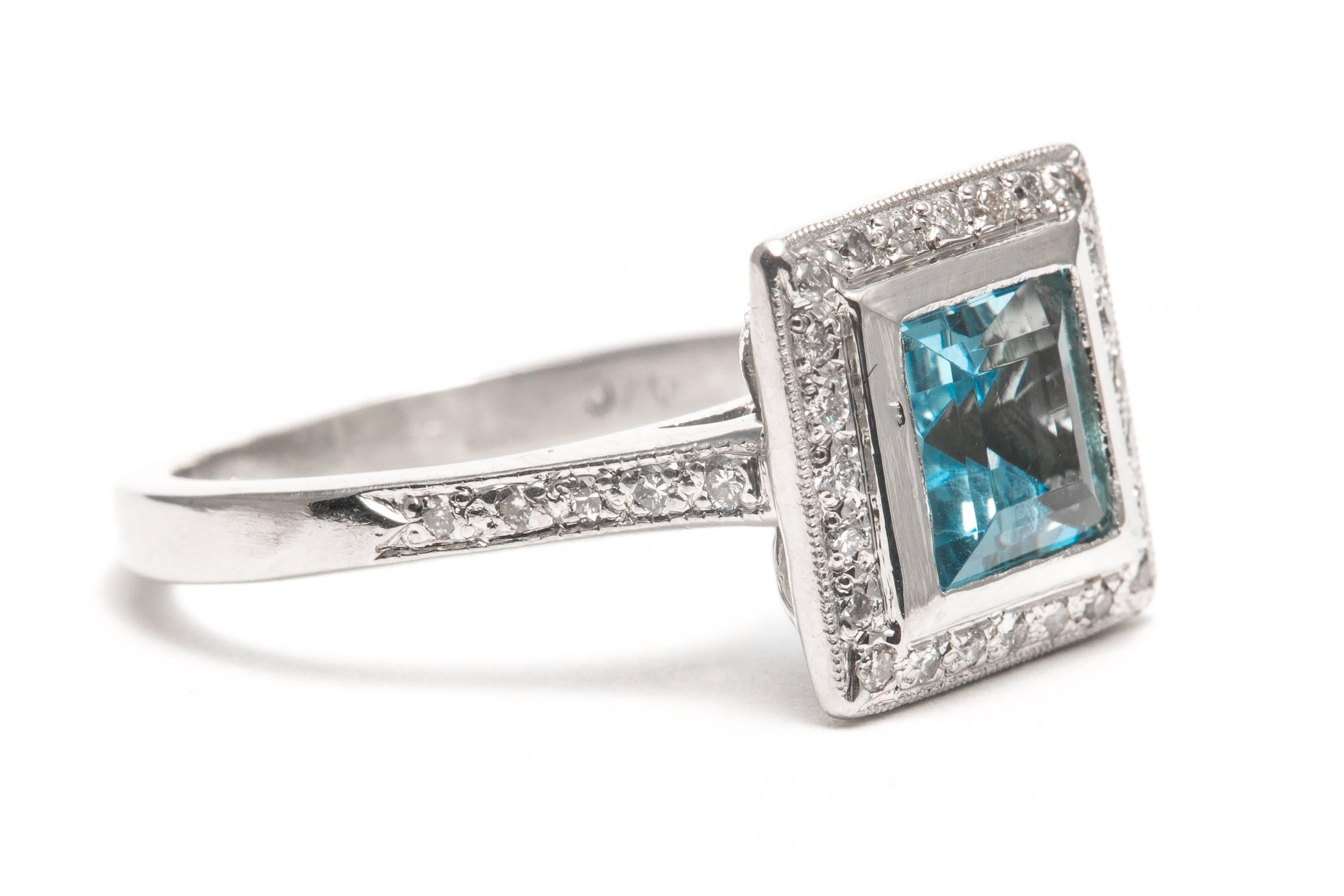 A beautiful aquamarine and diamond engagement style ring in luxurious platinum.   Centered by a 1.50 carat step cut aquamarine, this ring would make a wonderful March birthstone or promise ring that can later be used to hold a diamond.

Grading as