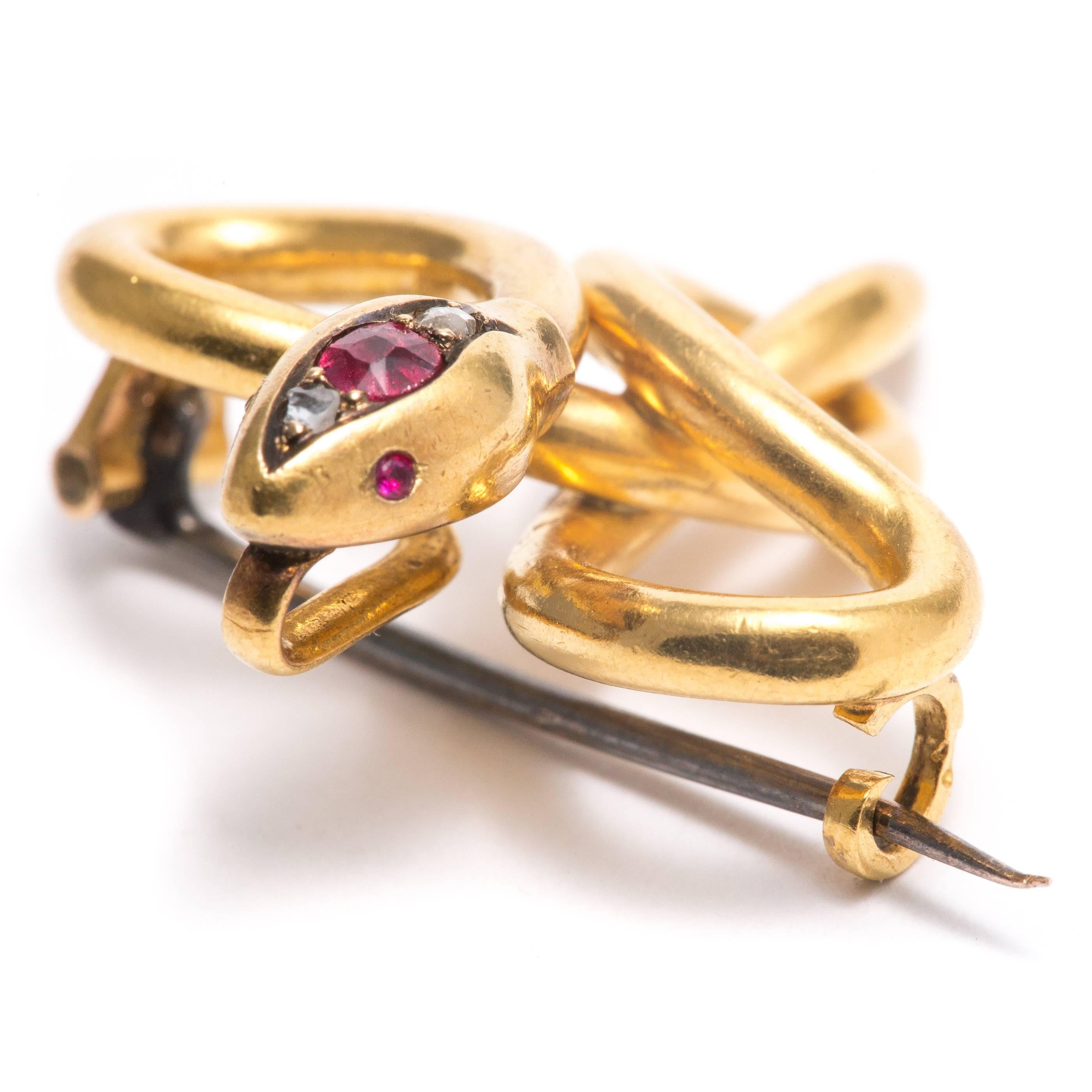 A French, art nouveau period serpent form brooch in 18 karat yellow gold.  Featuring  ruby and diamond set head along with ruby eyes, this brooch is beautifully crafted in a very fluid and French mannerism.

In excellent condition, this brooch