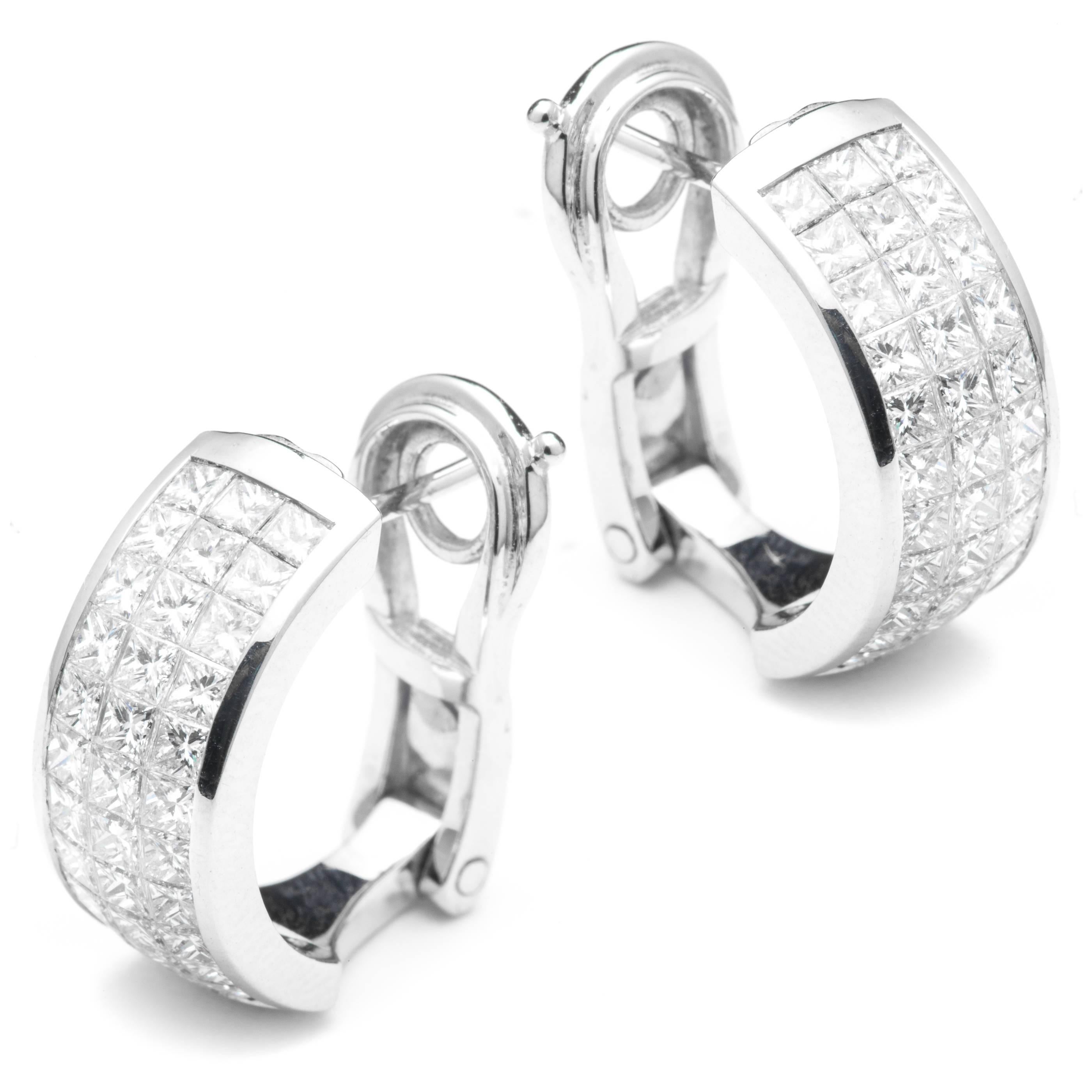 Beacon Hill Jewelers Presents:

A high quality pair of 18 karat white gold princess cut diamond earrings.  Featuring a total of sixty six invisible set princess cut diamonds these earrings boast a combined weight of 3.96 carats.

Grading as