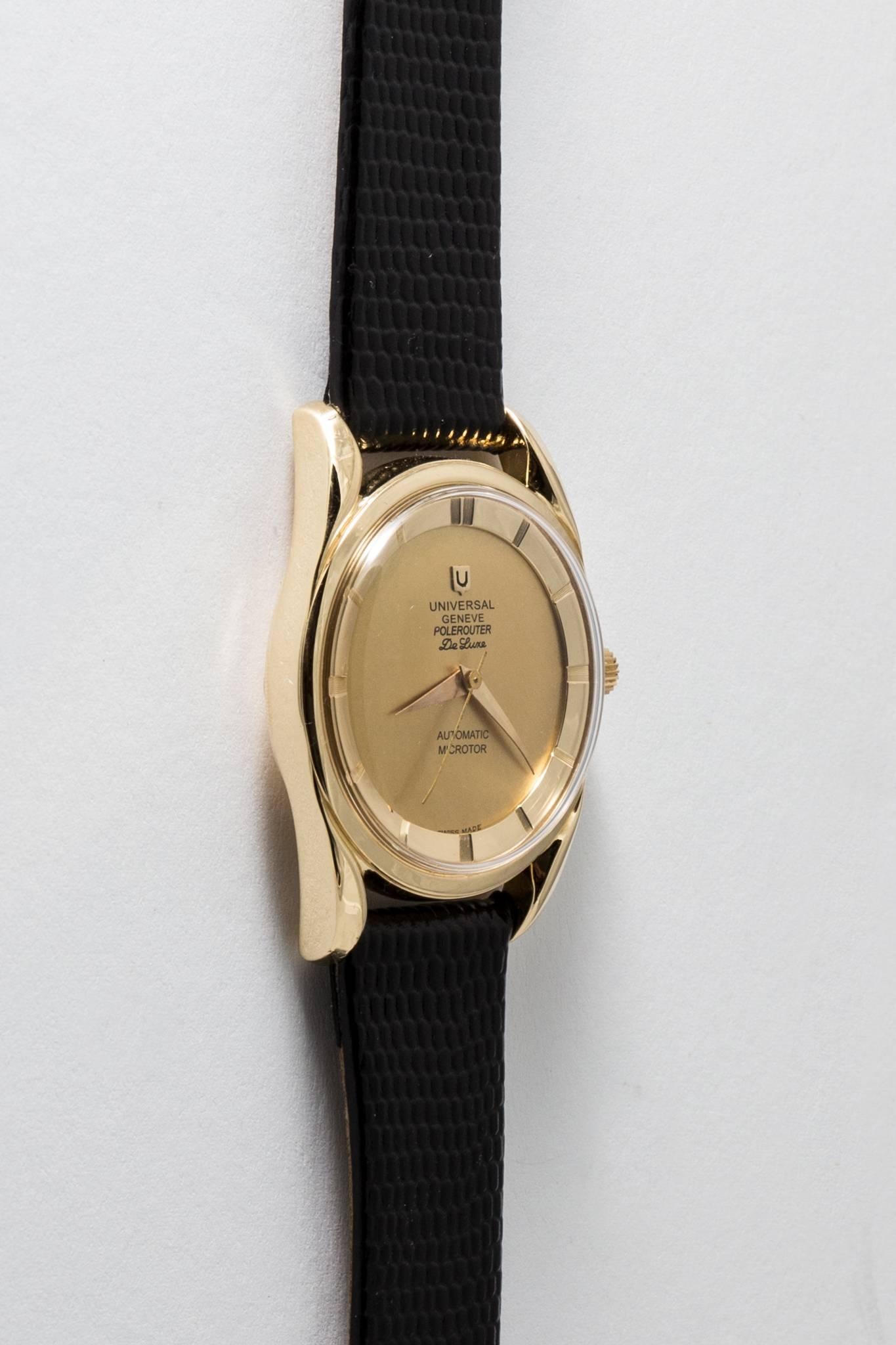 Beacon Hill Jewelers Presents:

A vintage mens Universal Geneve Polerouter De Luxe wrist watch in solid 18 karat yellow gold. Featuring a matte finish champagne dial surrounded by a brightly polished 18 karat gold ring engraved with the hours, this