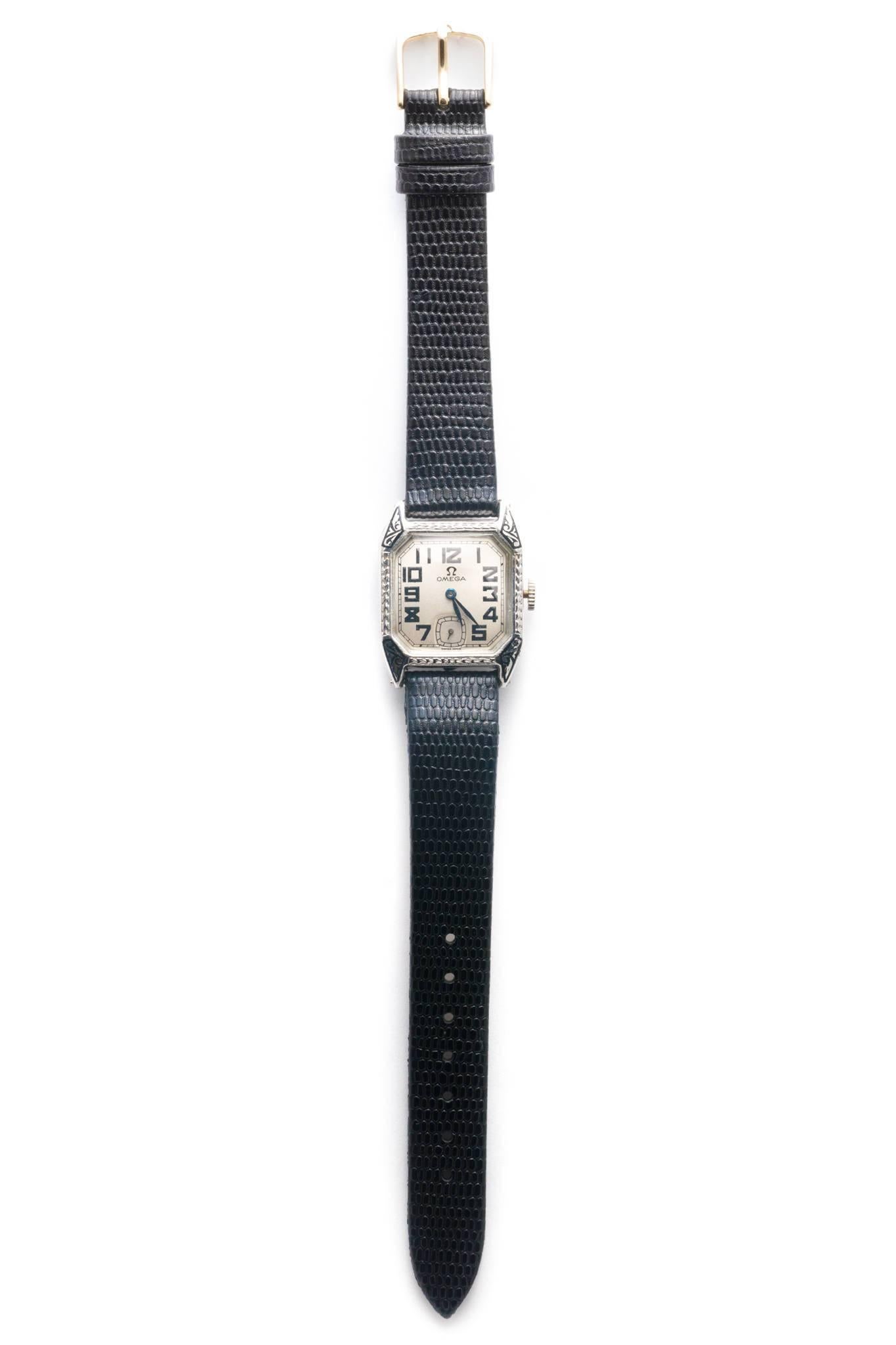 Beacon Hill Jewelers Presents:

A vintage mens art deco period Omega wrist watch in 14 karat white gold. Boasting beautiful hand engraving, and enameling on the brightly polished 14 karat white gold case, this vintage watch is in like new condition