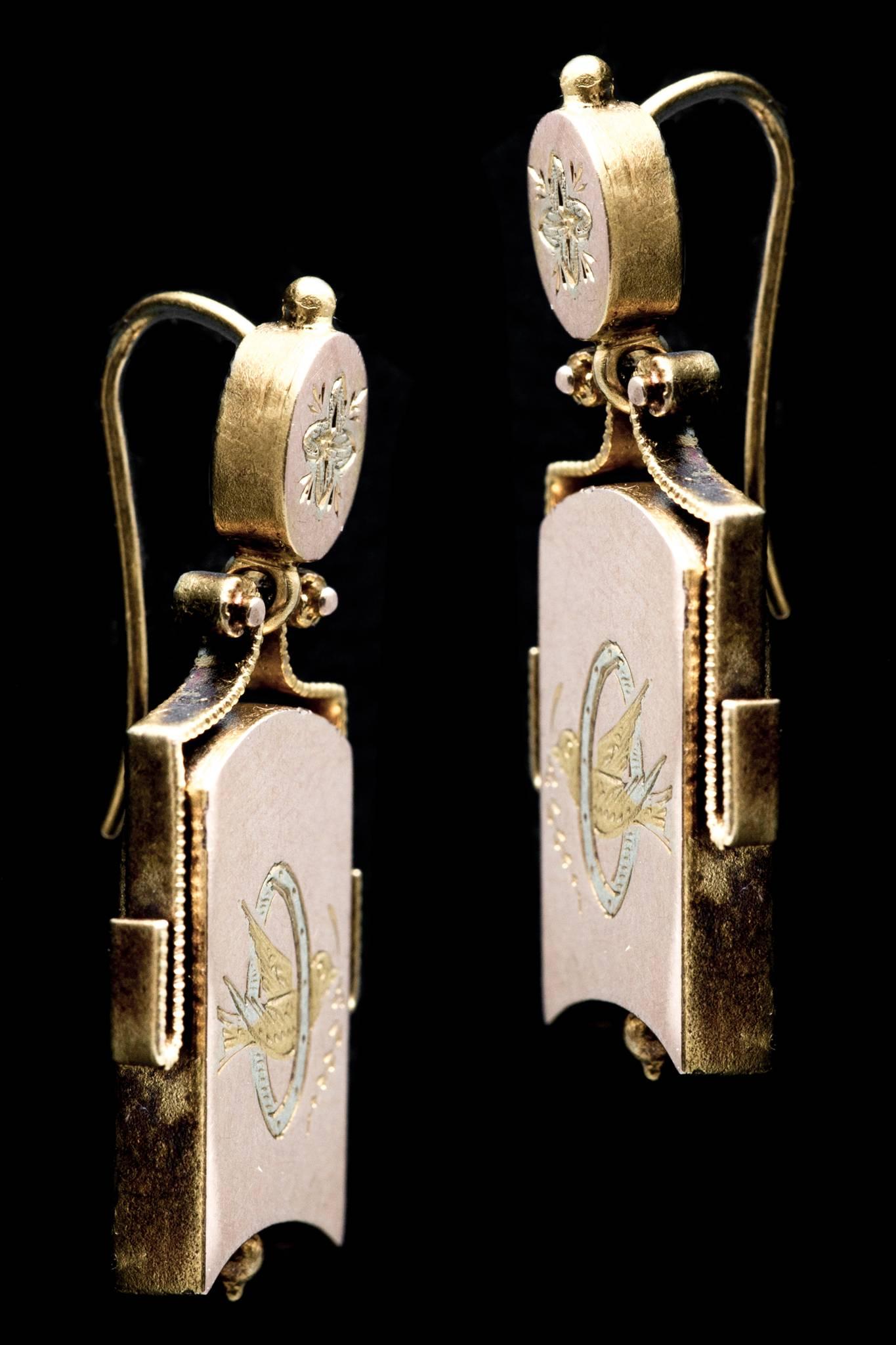 A pair of victorian period bird motif earrings in multiple colors of gold.  Crafted in yellow gold with a slight pink hue, these earrings feature accents in green, blue, and bright yellow gold~Colors not used in jewelry making since the very early