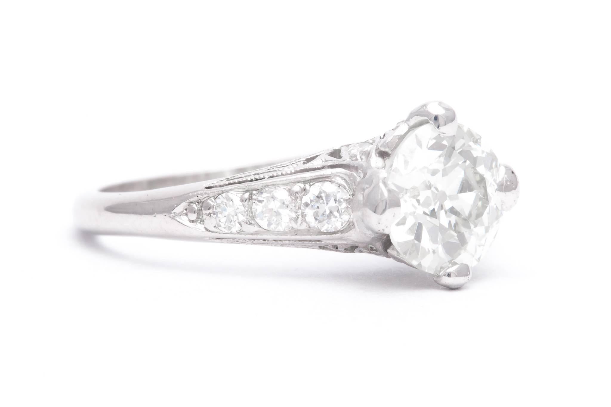 An art deco period diamond engagement ring in luxurious platinum.  Centered by a GIA Certified 1.53 carat Old European cut diamond this ring features a beautiful hand crafted platinum mounting.

Grading as beautiful VS2 clarity and K color, the 1.53