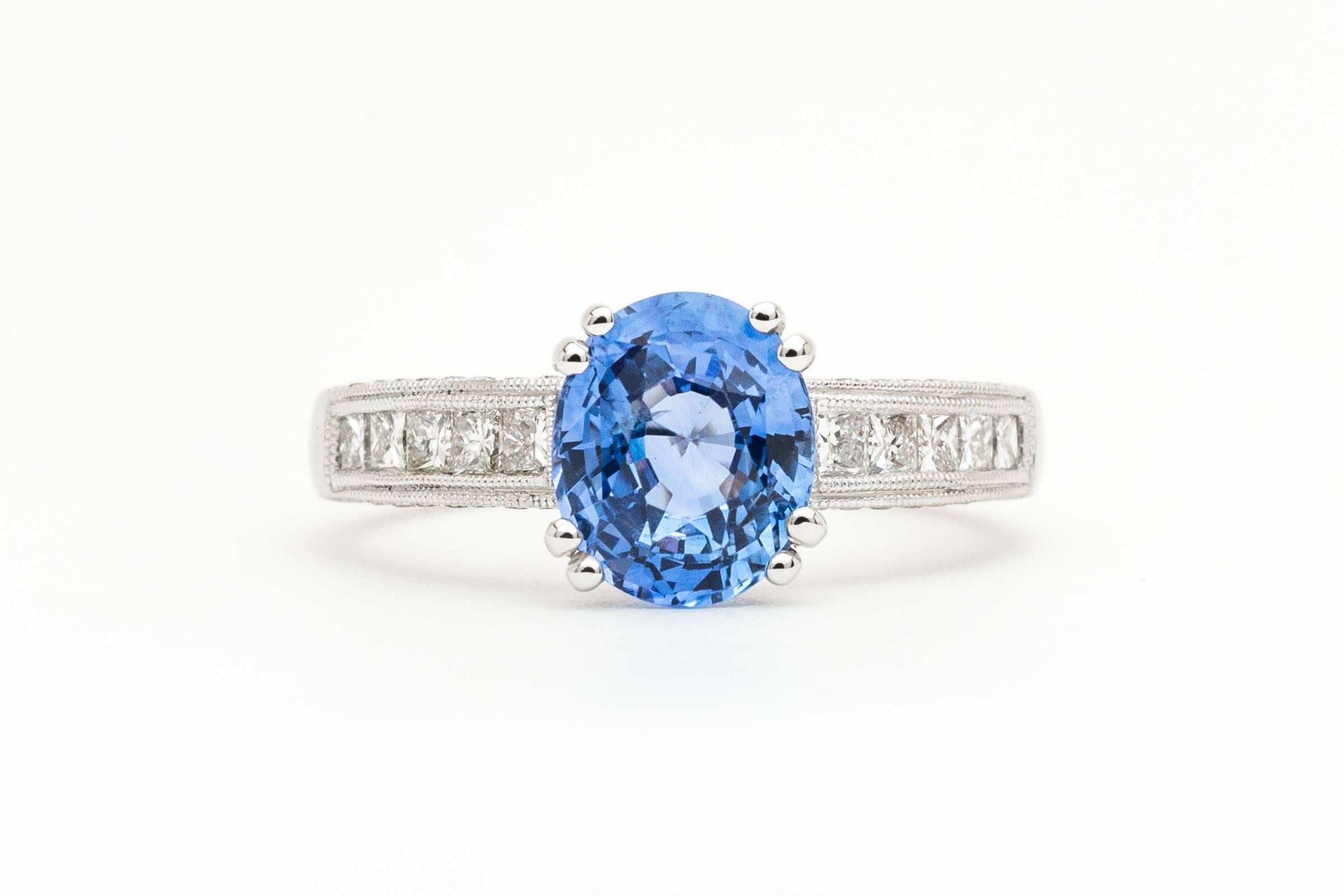 A beautiful ceylon sapphire and diamond ring in luxurious 18 karat white gold. Centered by a very high quality beautiful vivid blue 2.21 carat Ceylon sapphire this ring features accenting diamonds throughout in a high quality hand crafted