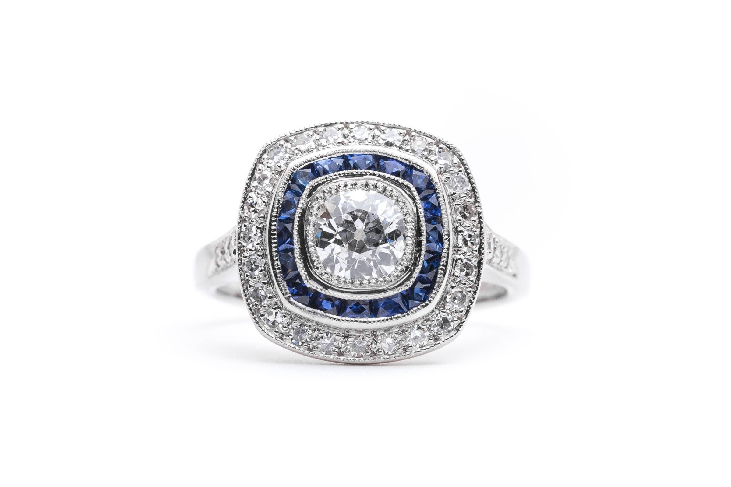 Beacon Hill Jewelers Presents:

A beautiful handmade French cut sapphire and European cut diamond ring in luxurious platinum. Centered by a sparkling old European cut diamond, this ring features an inner halo of French cut sapphire and an outer halo