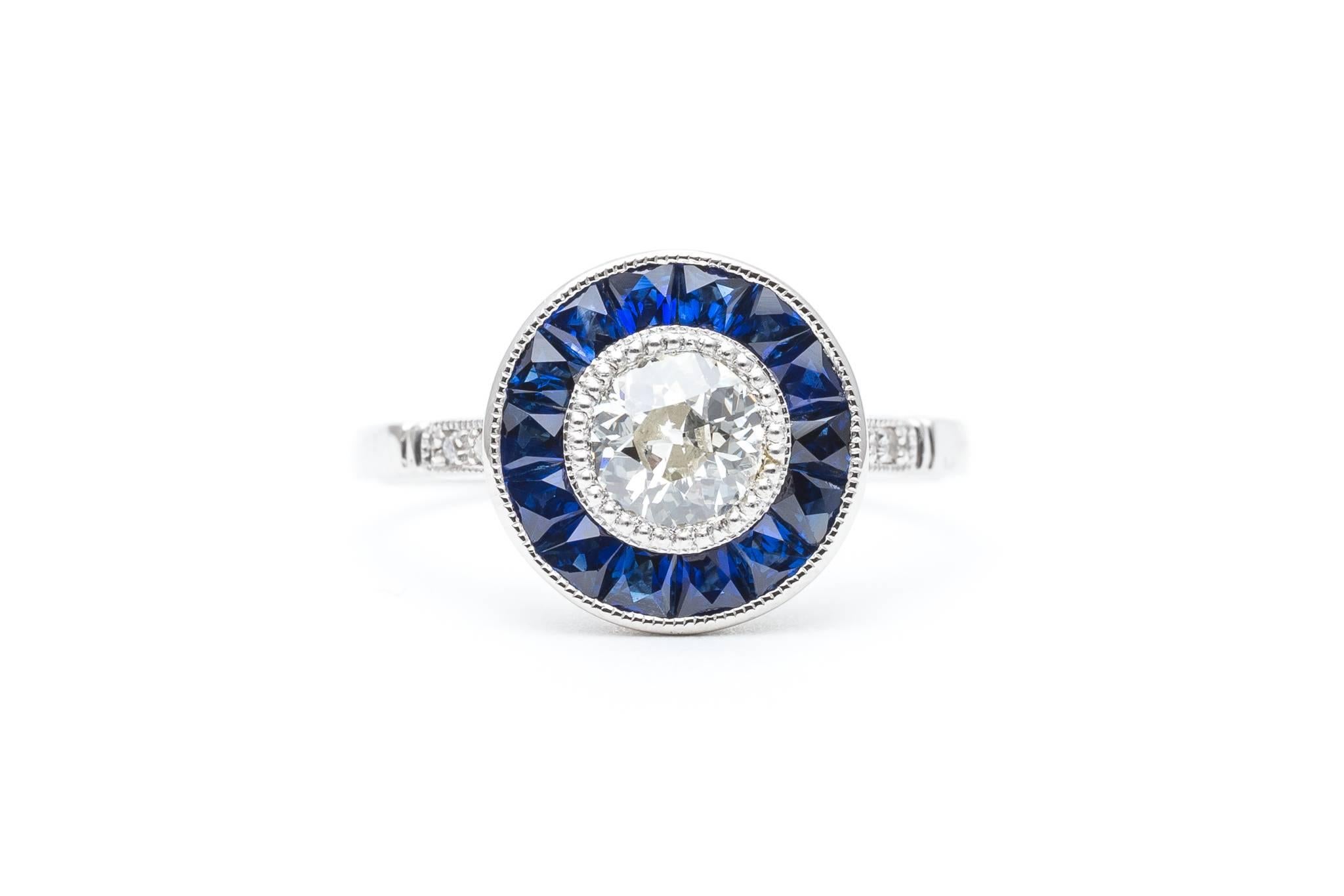 Beacon Hill Jewelers Presents:

A stunning diamond and sapphire target ring in luxurious platinum. Completely hand crafted, this stunning target ring is a prime example of a French style engagement ring. Centered by a single antique European cut