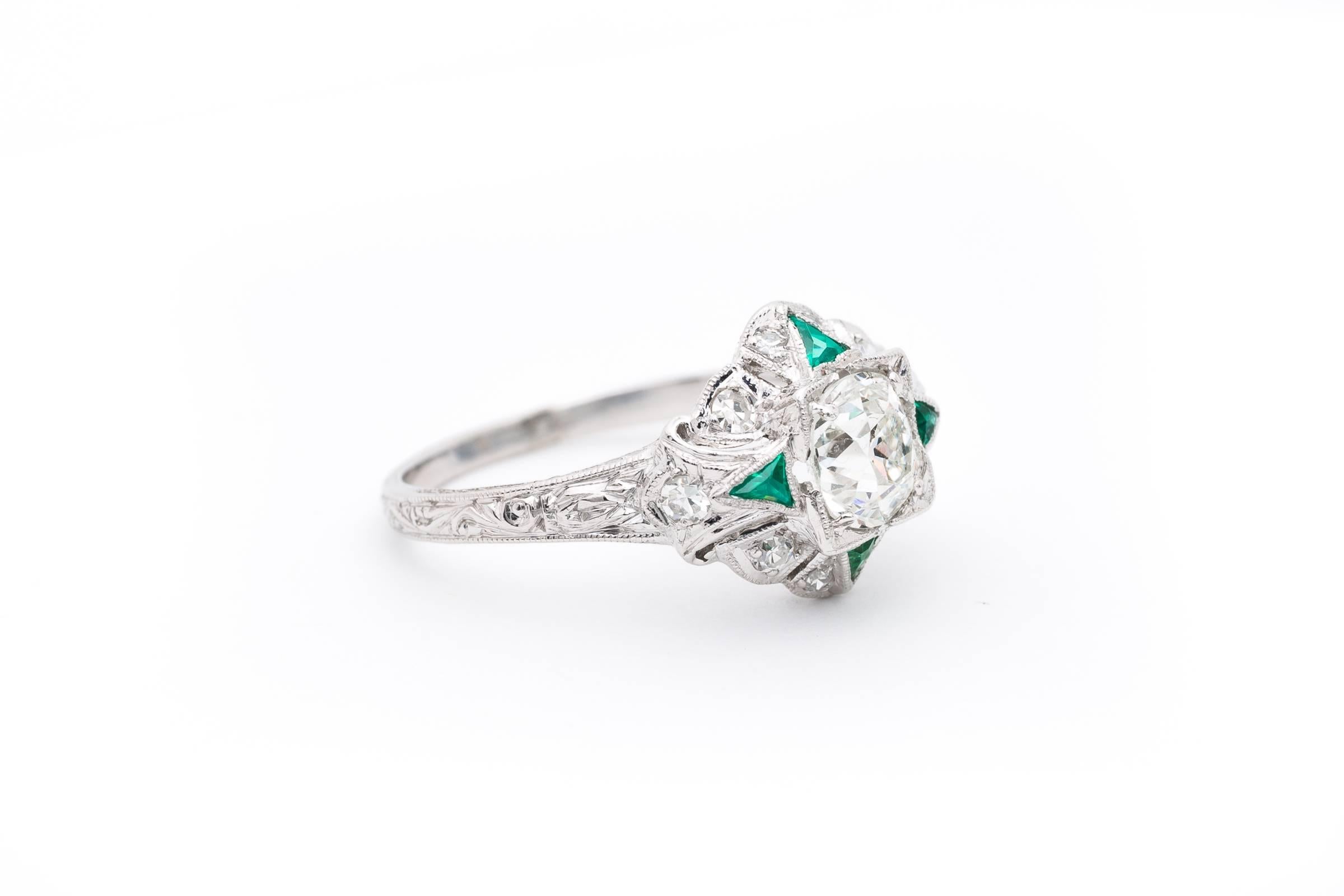 A true original art deco period masterpiece, this stunning ring features elaborate hand engraving throughout the beautiful hand crafted solid platinum mounting. Centered by a high quality 0.95 carat GIA Certified  diamond, the mounting is accented