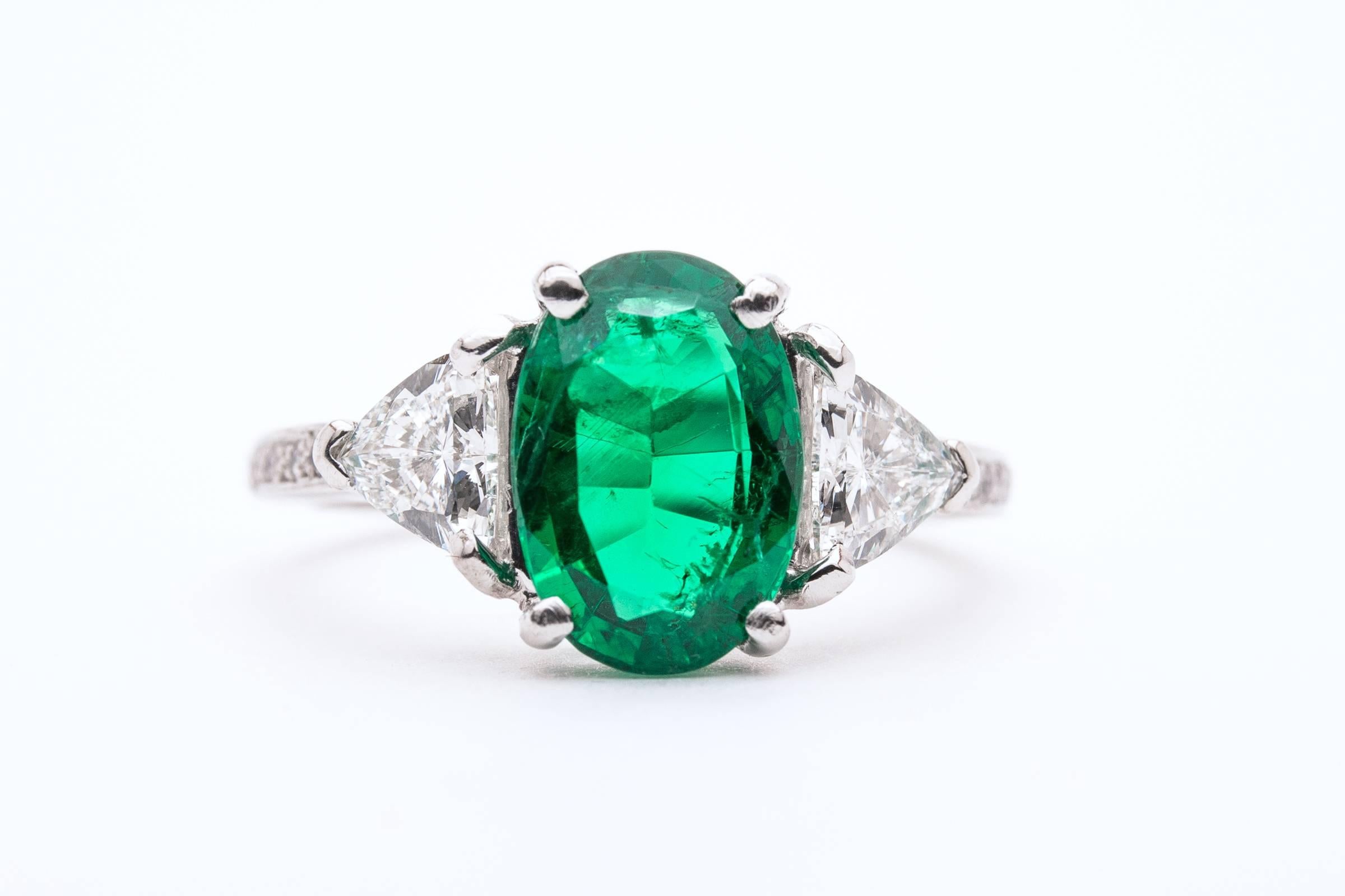Beacon Hill Jewelers Presents:

On Sale for a limited time only! Was $9995 now $4995

A phenomenal quality emerald and diamond ring in platinum. Featuring a top quality oval cut emerald framed by trillion cut diamonds in platinum, this superb ring