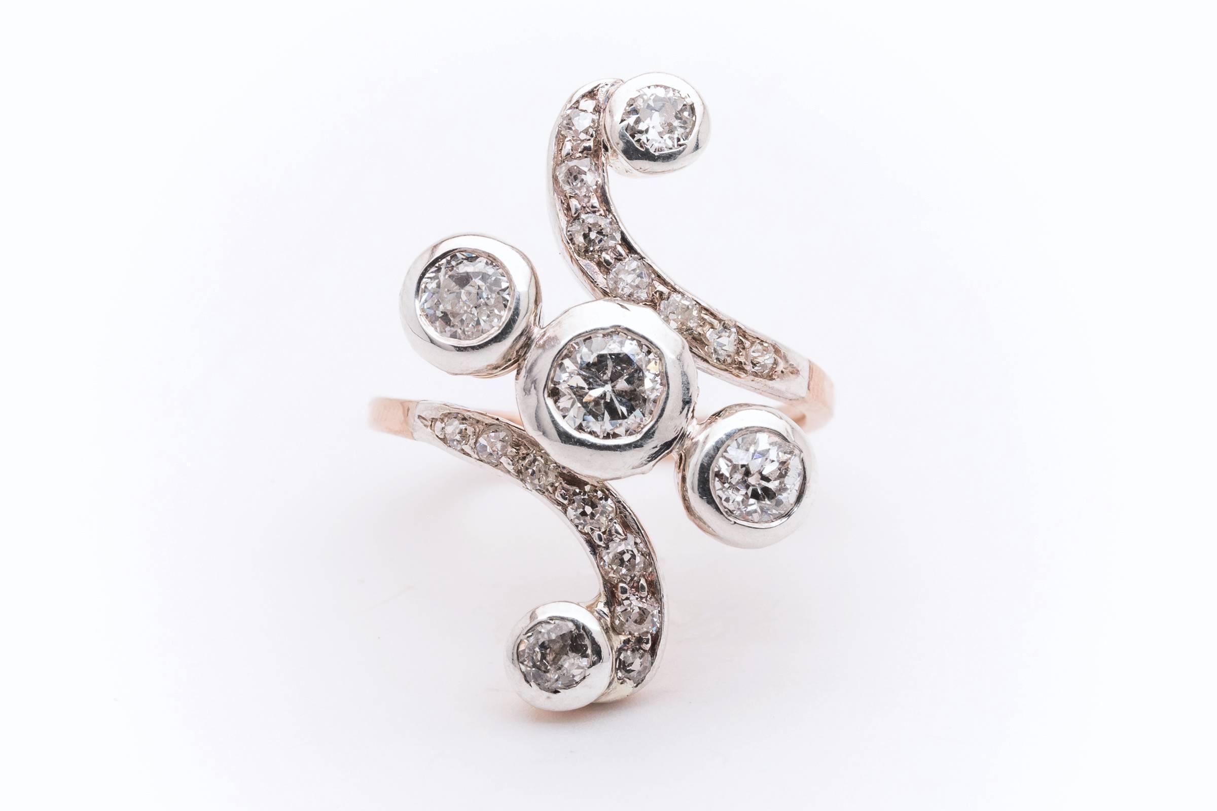 Beacon Hill Jewelers Presents:

A gorgeous victorian era diamond cocktail ring in rose gold and platinum. Set with a total of 1.72 carats of old European cut diamonds, this fantastic swirl design ring features a rose gold mounting and body with