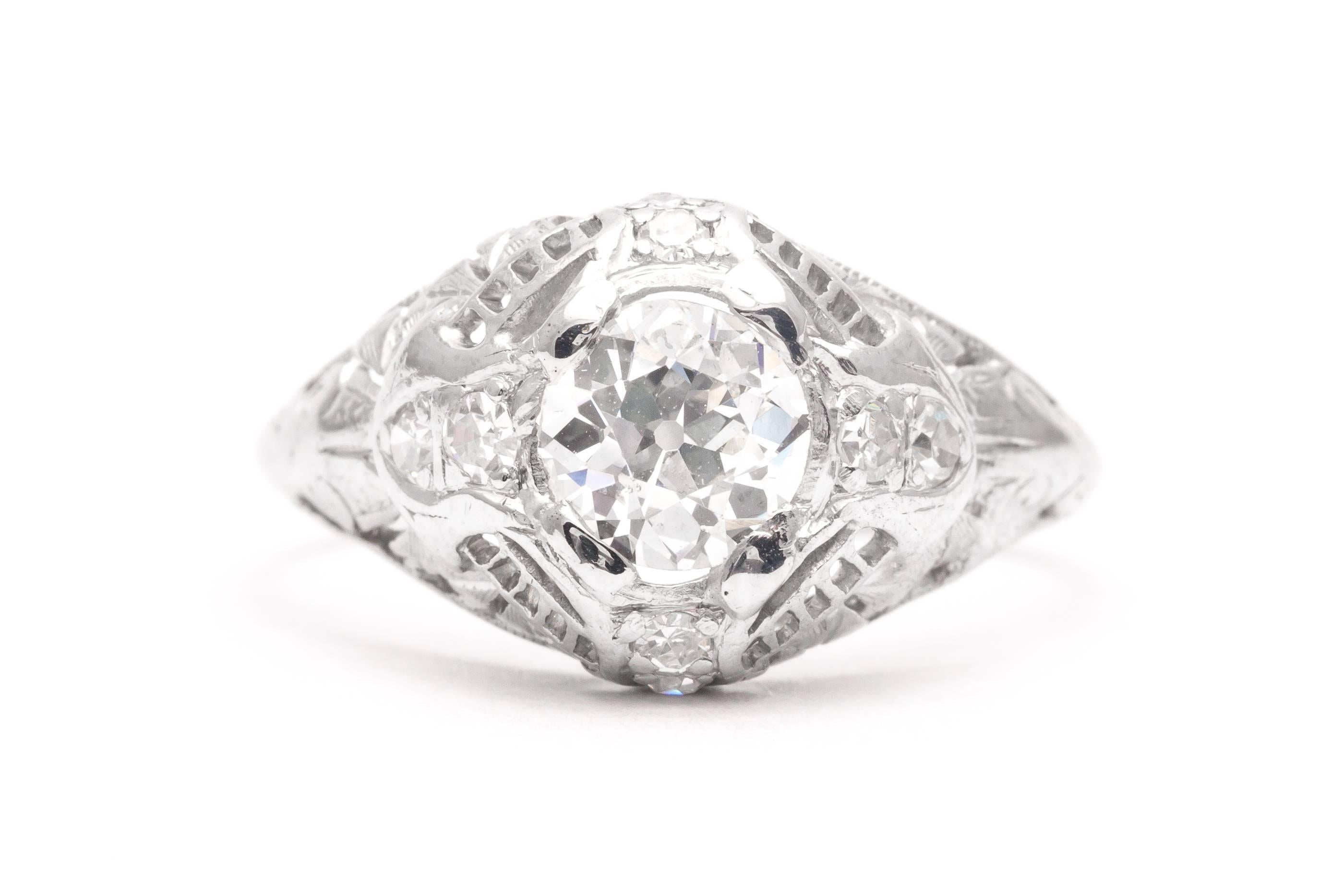 A beautiful original art deco period diamond engagement ring in luxurious platinum. Centered by a sparkling old European cut diamond weighing 0.75 carats, this ring features a total of eight pave set accenting diamonds.

Secured by four brightly