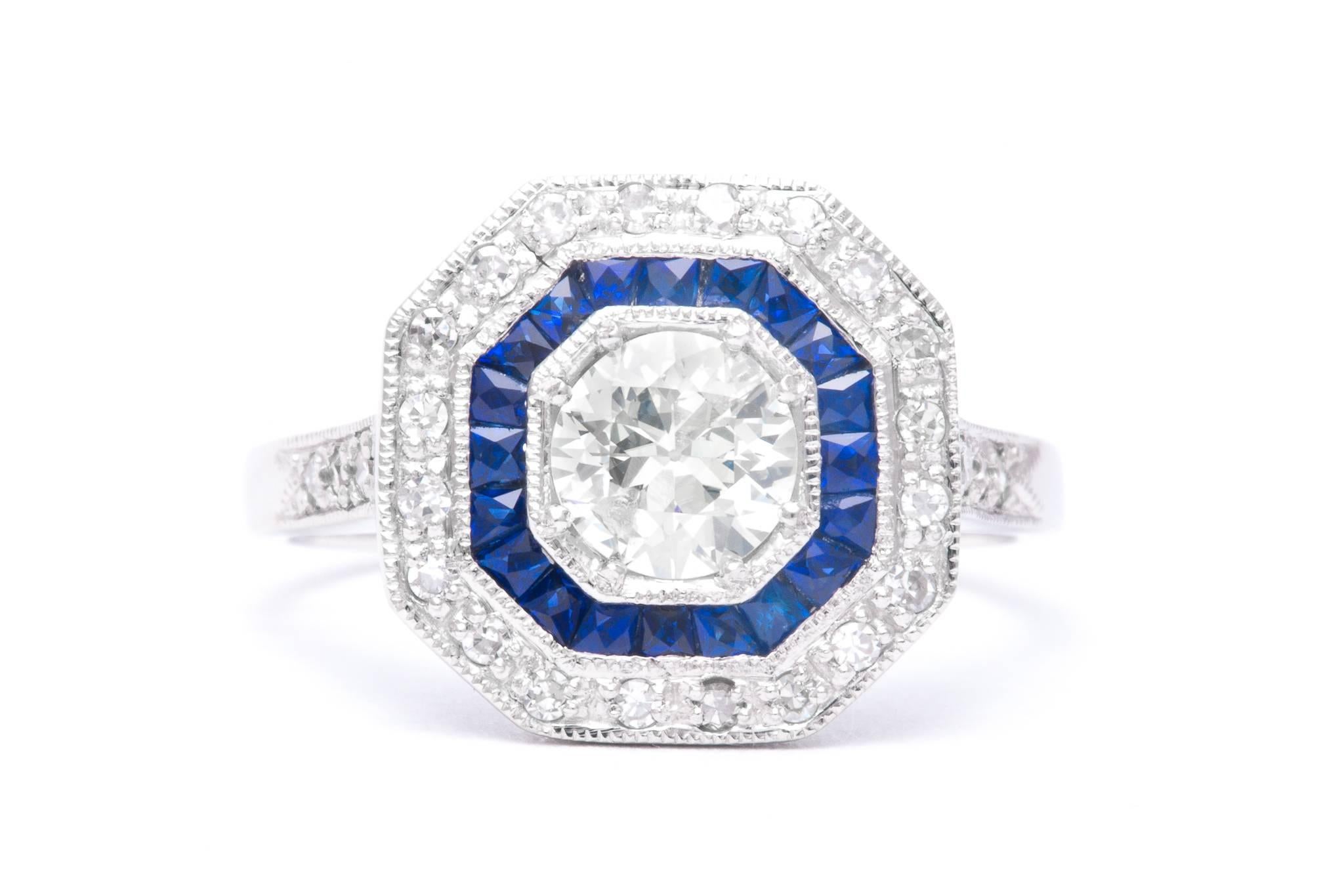 An exceptionally beautiful french cut sapphire and diamond ring in luxurious platinum. Featuring beautiful French cut sapphires, sparkling single cut and antique mine cut diamonds, and hand applied mille grain beading, this ring is a truly stunning
