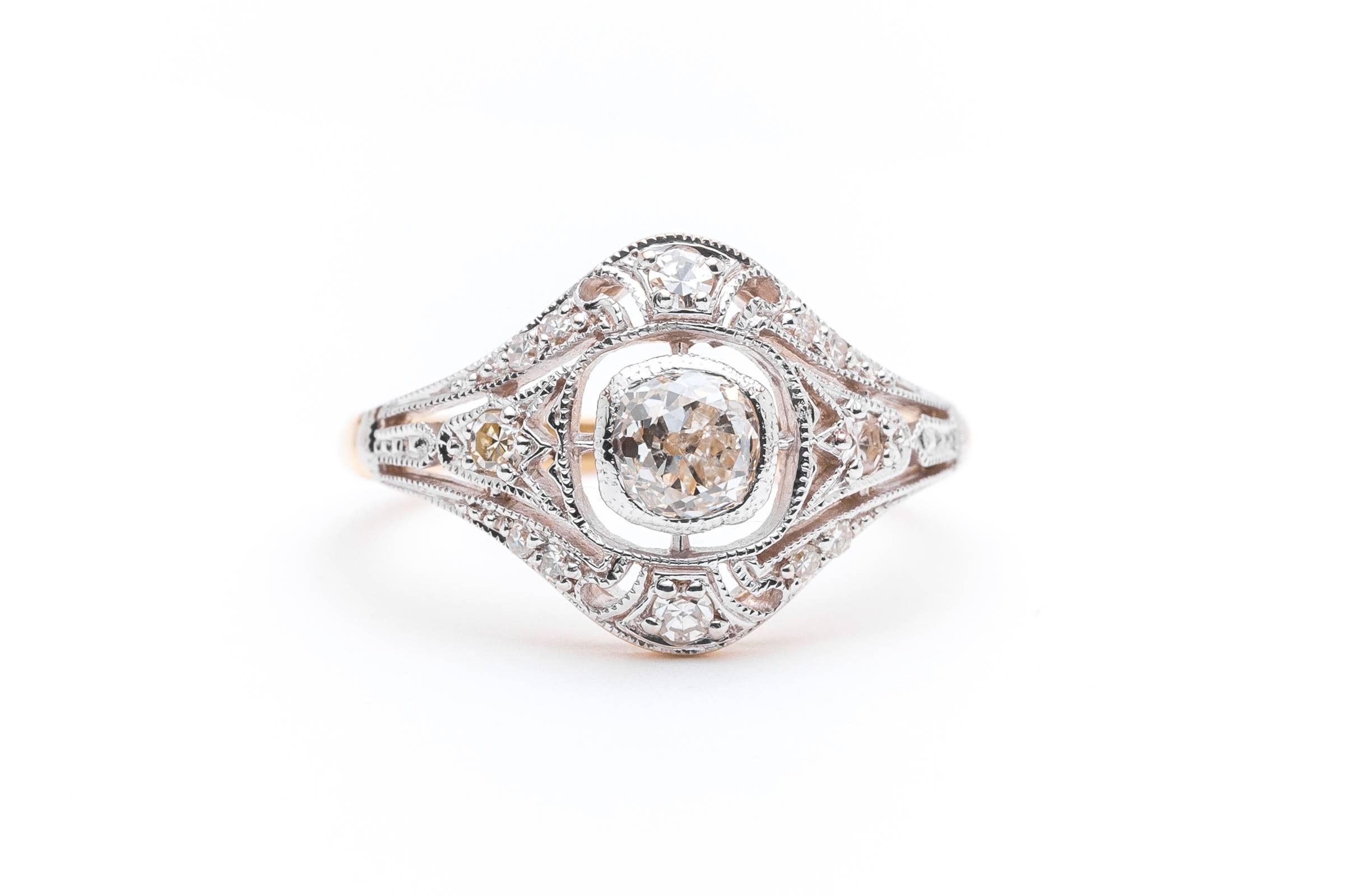 Beacon Hill Jewelers Presents:

A beautiful handmade edwardian platinum and 18 karat yellow gold diamond engagement ring. Centered by a beautiful antique mine cut cushion shaped diamond, this ring features a platinum top as is traditional in