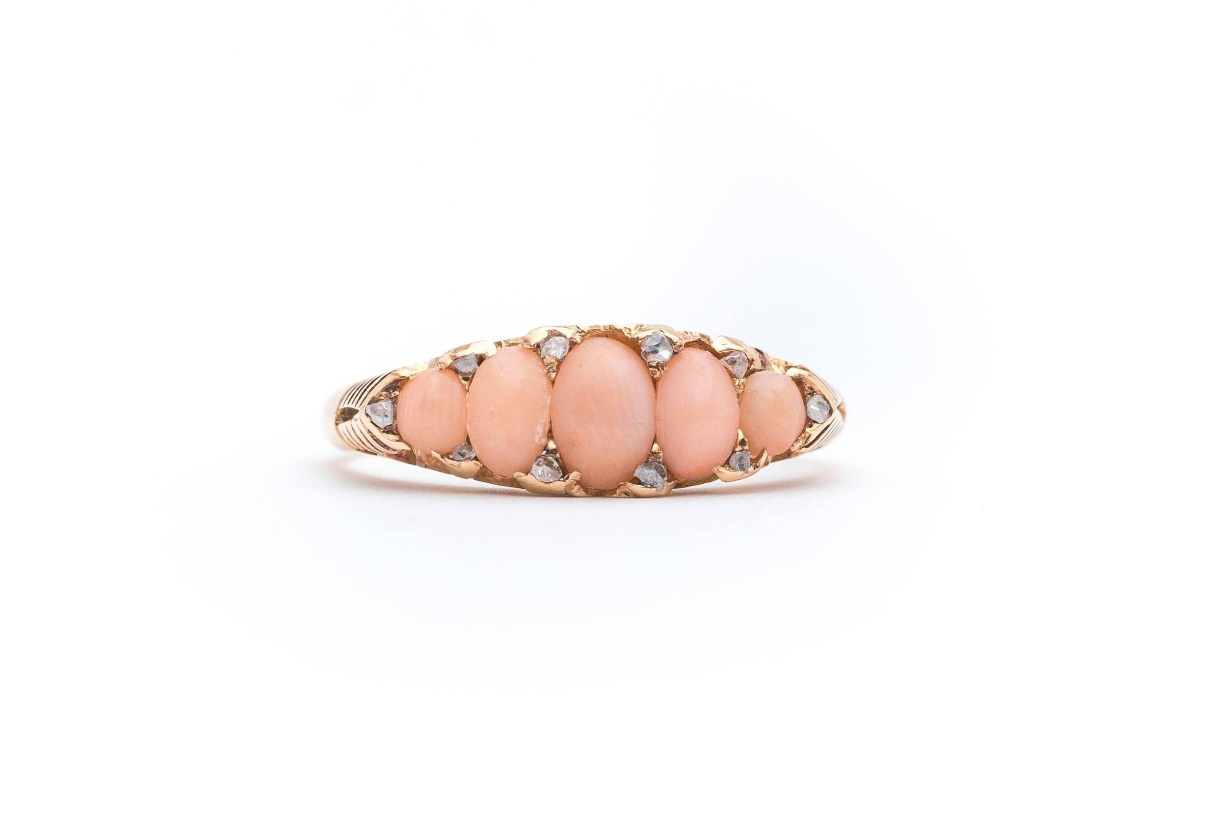 Beacon Hill Jewelers Presents:

An original victorian period English made coral and rose cut diamond ring in rich 18 karat yellow gold. Centered by five cabochon cut angel-skin cool of tapered size, this ring is accented by a total of ten petite