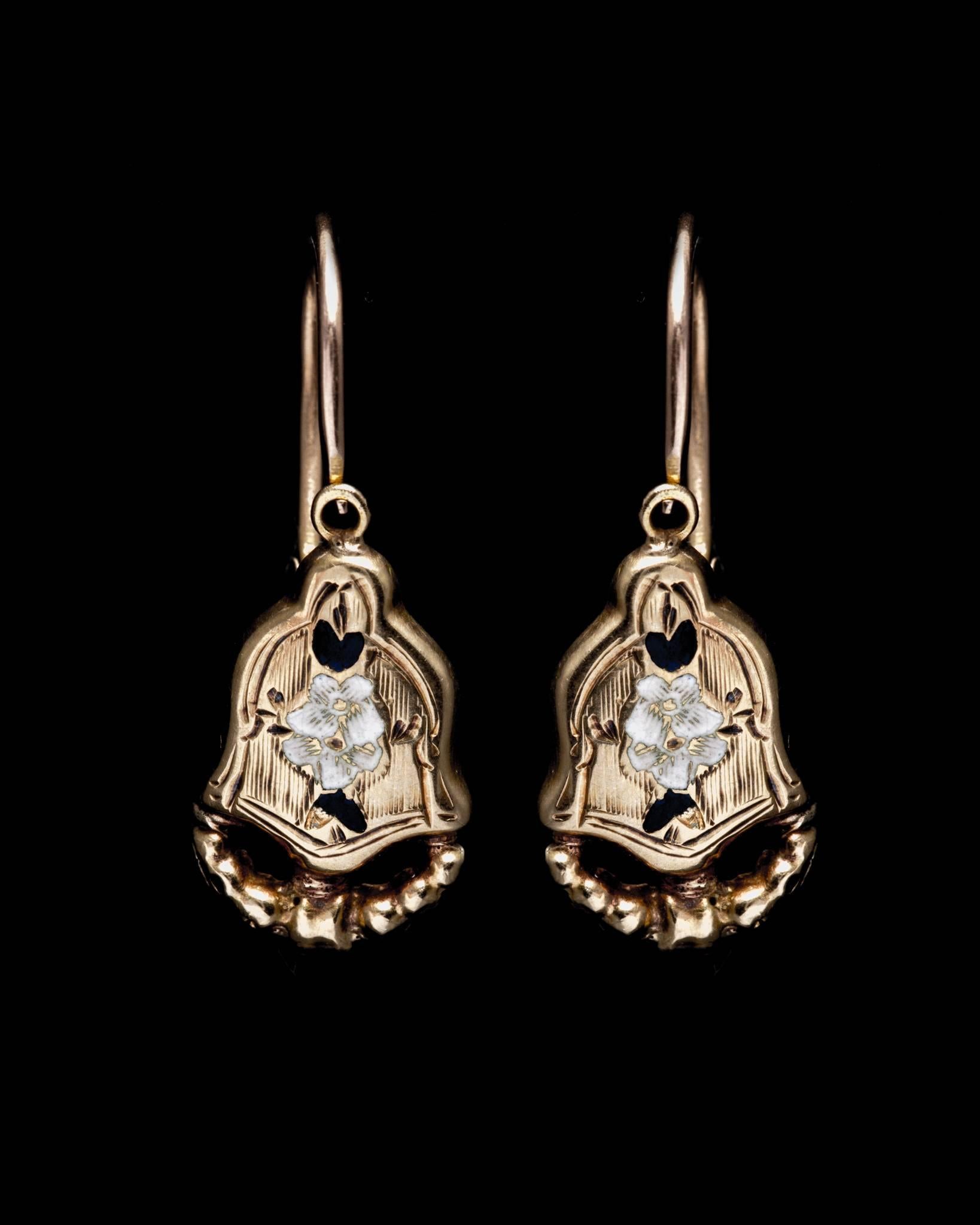 Beacon Hill Jewelers Presents:

An antique pair of mid 19th century French hallmarked day and night earrings in yellow gold.  Designed to be worn as a smaller pair of lever back earrings during the day, these earrings also come with an extended