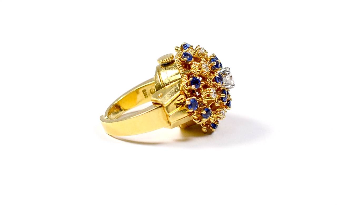Age: Vintage 1950's

Brand: Tiffany & Co 

Style: Watch Ring 

Metal: Yellow Gold 

Stones: Diamonds & Sapphires