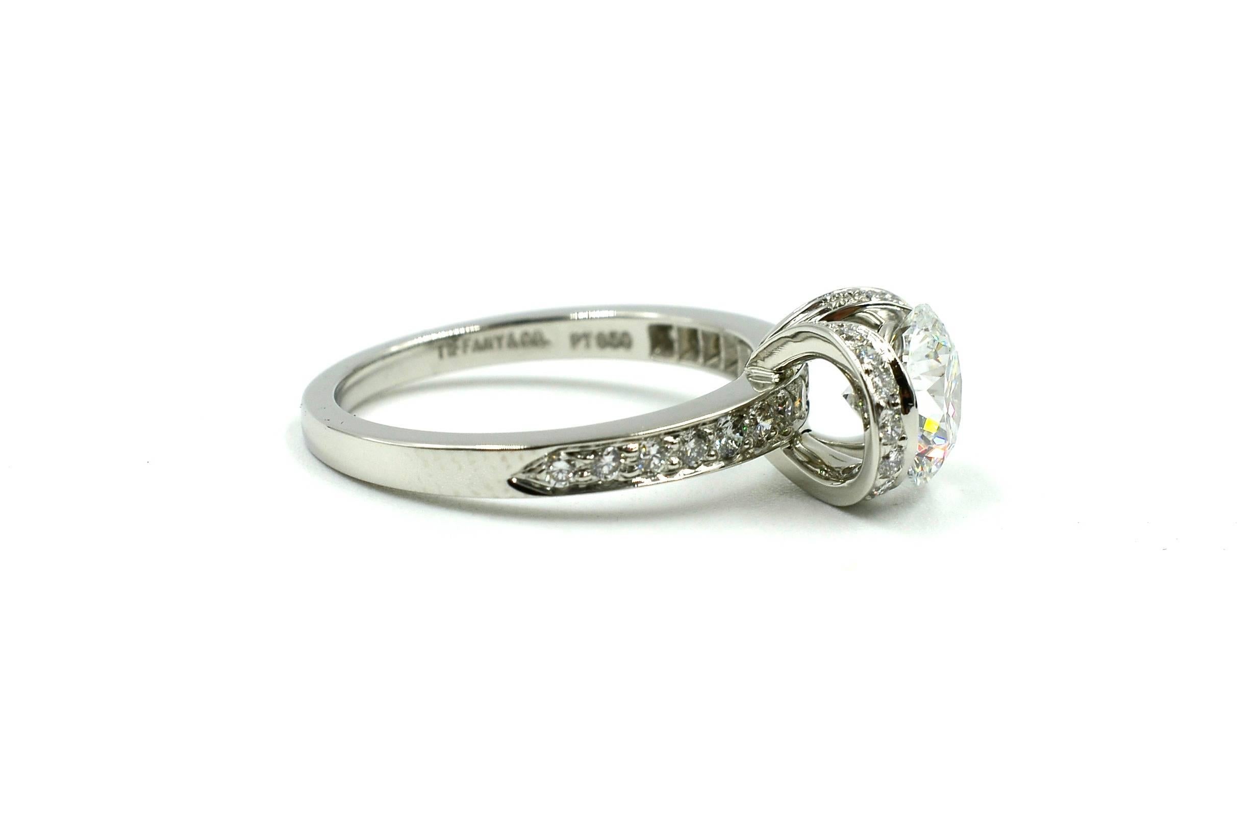 Brand: Tiffany & Co

Metal: Platinum

Style: Round Brilliant Ribbon Ring

Diamond Size: 1.21ct 

Diamond Color: D

Diamond Clarity: VS1.

Ring Size: 5

Tiffany Papers: Yes

Tiffany Box: Yes