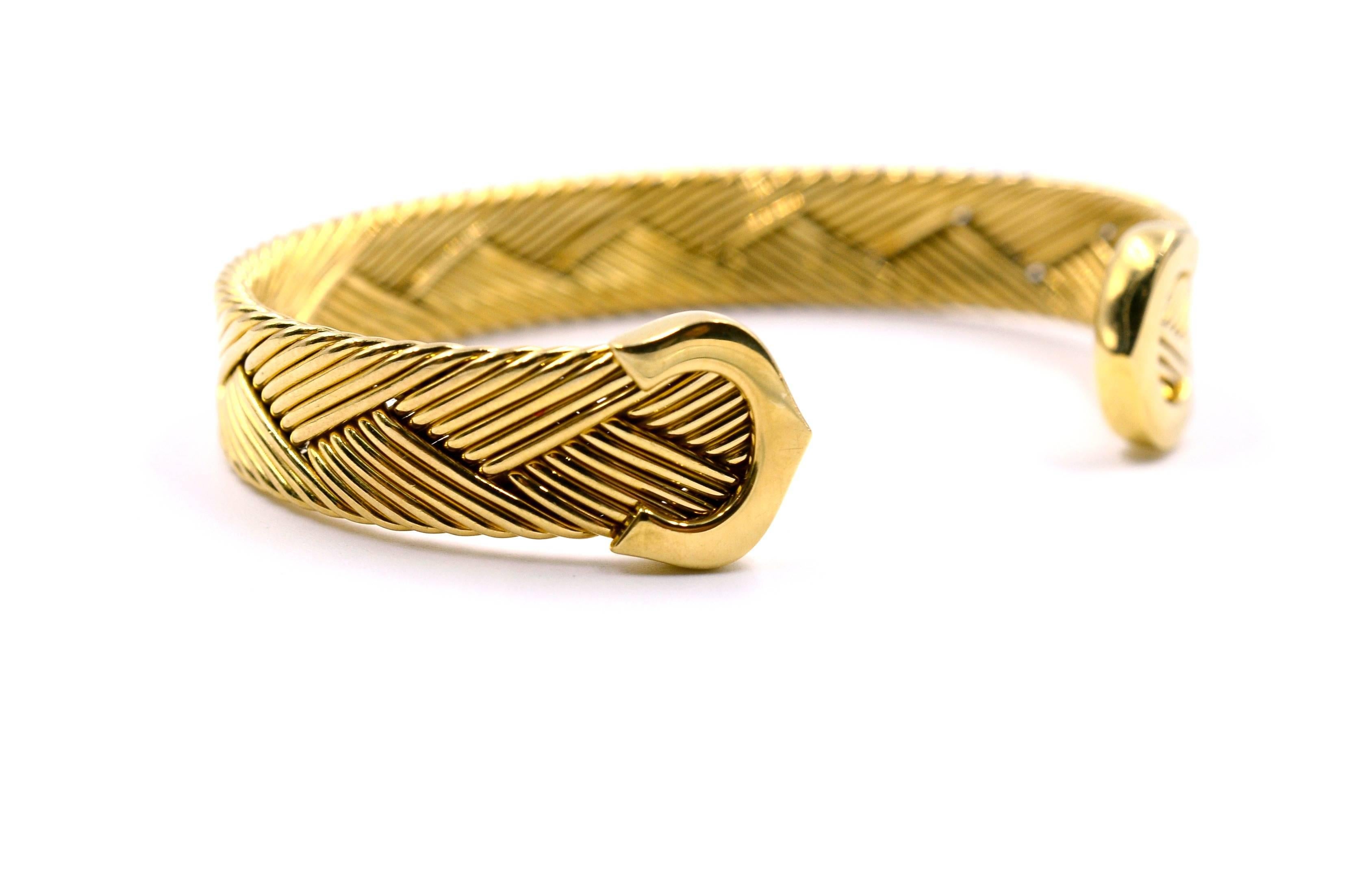 Brand: Cartier

Model:  C De Weave Design

Age: Vintage 1970's

Metal: 18k Yellow Gold

Hallmarked: Cartier 750 778832