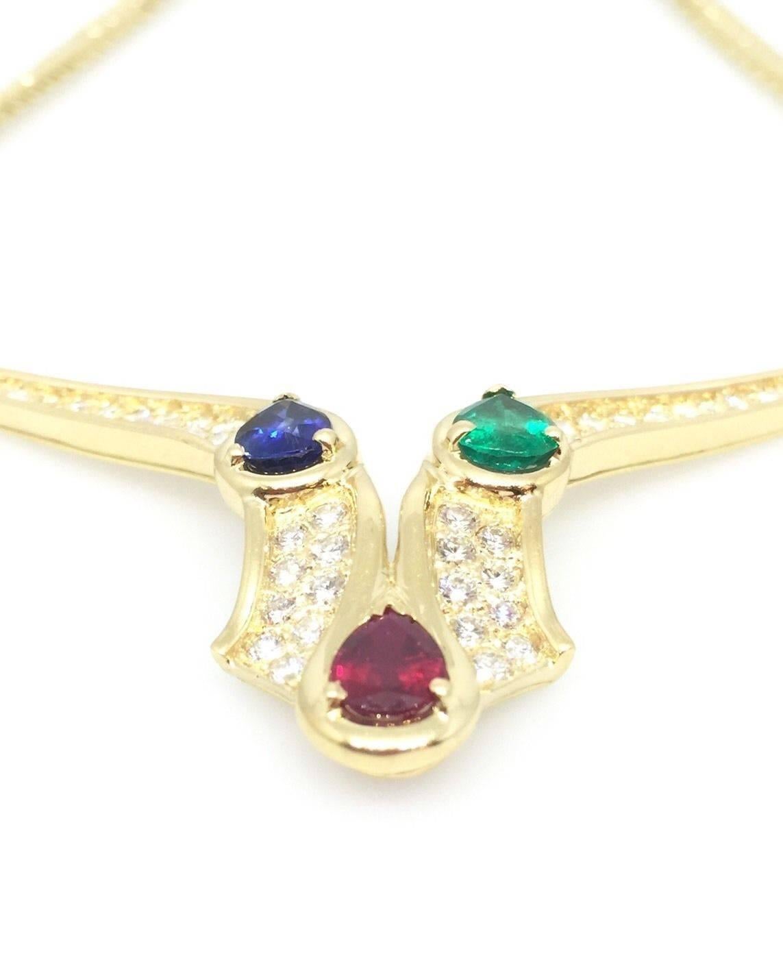 Vintage MAUBOUSSIN necklace in 18k yellow gold featuring 3 high quality pear-shaped Sapphire, Emerald and Ruby weighing approx 1.00 ct each, and approx 2.00 cts of round brilliant cut diamonds, H color, VS clarity.

Beautifully crafted 18k yellow