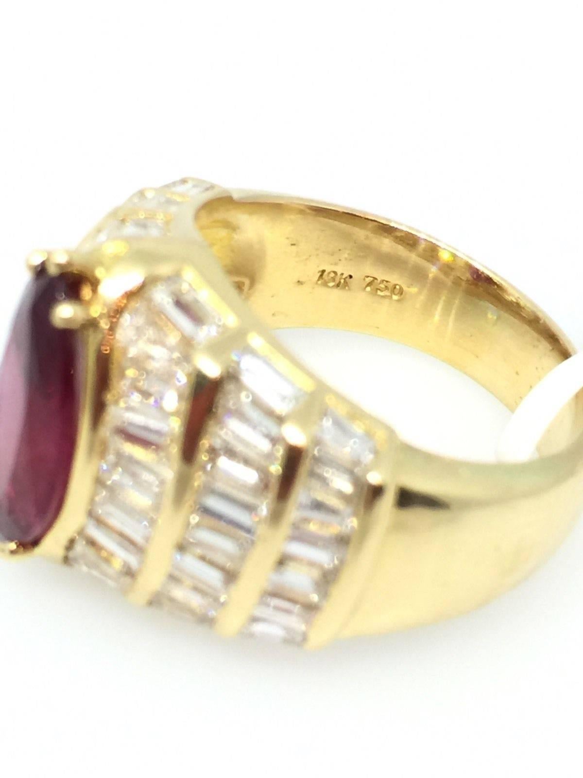 Ruby diamond ring features 3.72 ct Marquise shaped Ruby in the center
GIA Certified, surrounded by 54 Baguettes cut diamonds totaling 3.00 carats. Diamond quality is est. I-J color and VS2-SI clarity. Ring is 15.5 mm wide across the top and