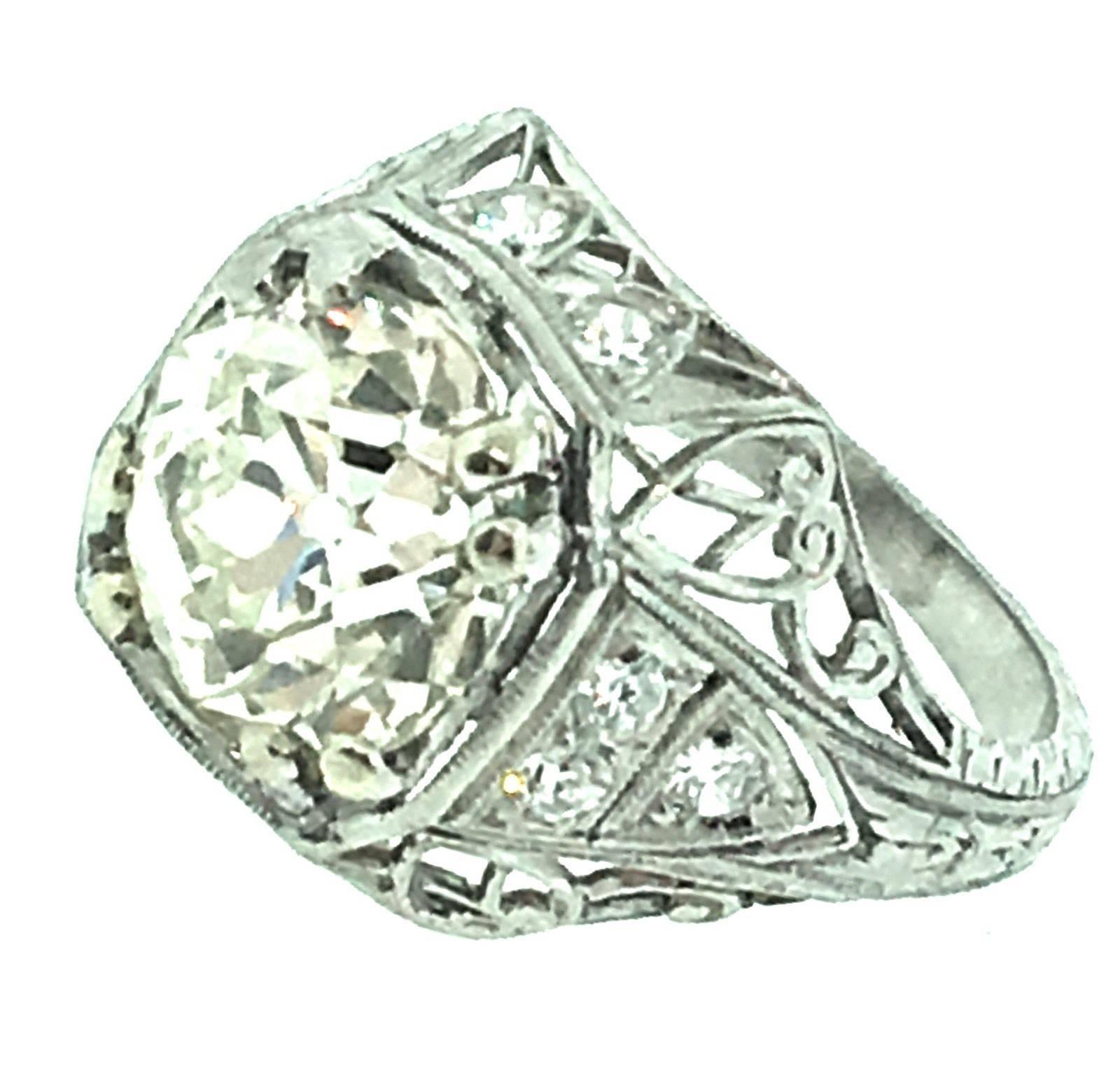 All original antique diamond ring with old world craftsmanship, fine openwork, filigree and milgrain details. GIA Certified 2.92 ct Old European Brilliant cut center, VS1 in Clarity, M in color (faces up white, looks like J-K color)
[ Stone