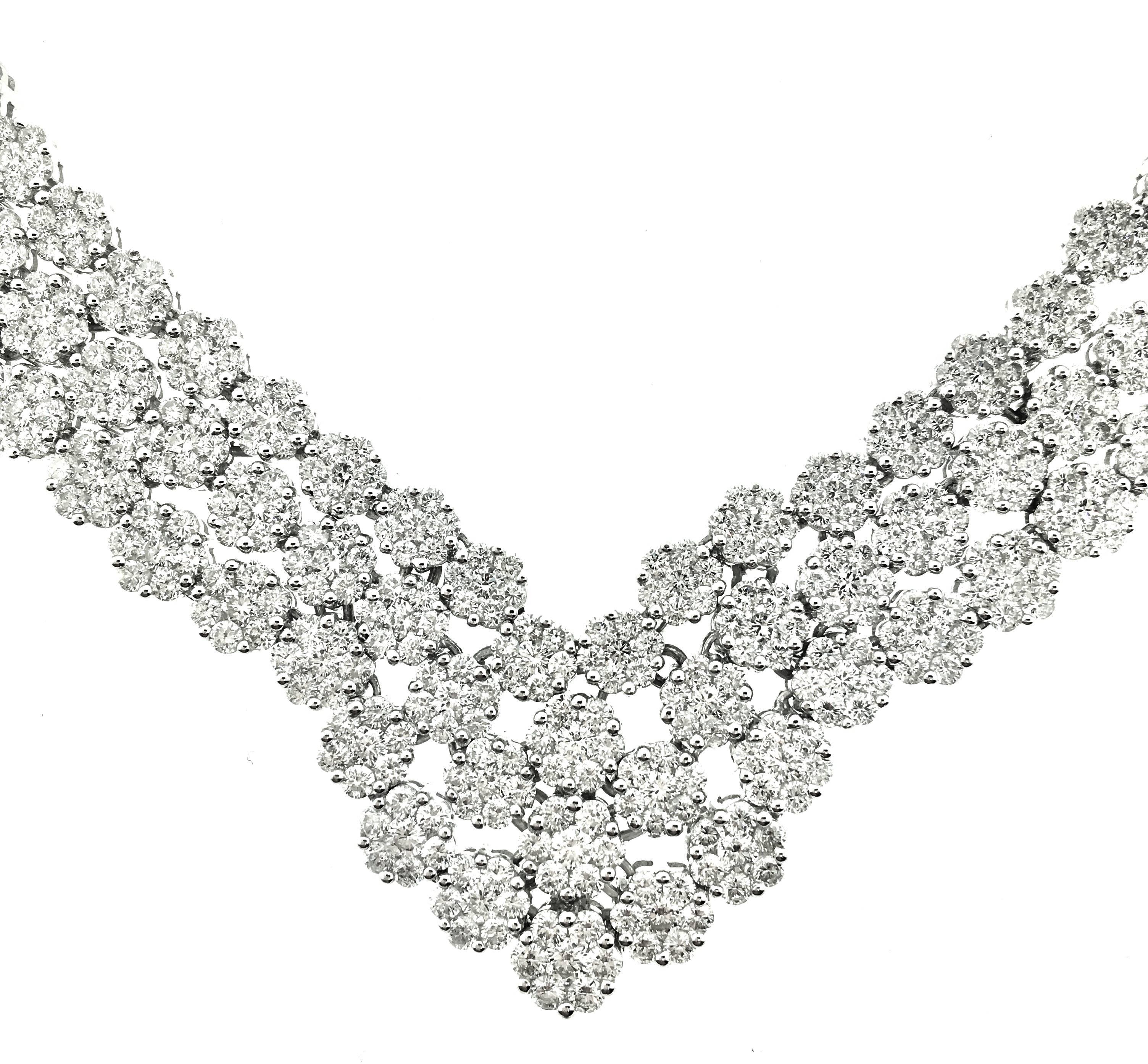 Three-row Diamond Cluster Collar Necklace in 18k White Gold. Each cluster of diamonds is composed of a circle of 6 Round Diamonds with one in the center. Total of 301 individual round full-cut diamonds for a total diamond weight of 20.00 ct.  Back