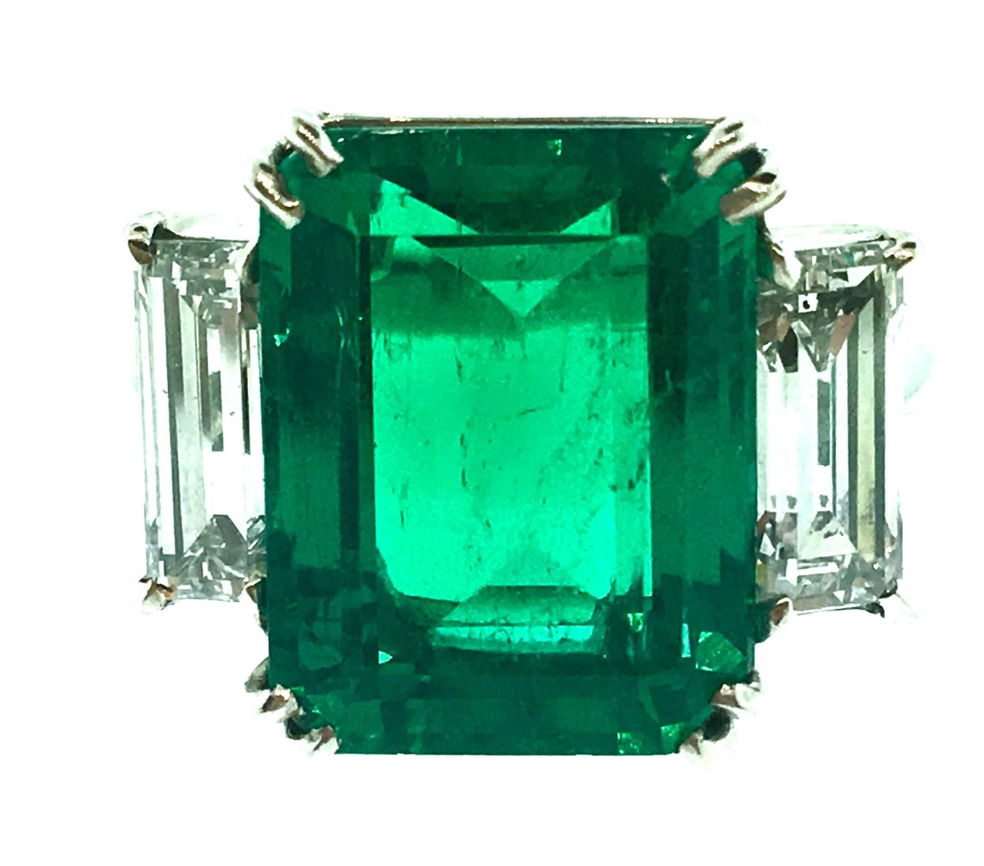 7.39 ct Colombian Emerald ring with two baguettes on the side, set in Platinum.

Emerald Measurements: 13.77 x 10.62 x 6.42 mm
Shape/Cutting Style: Octagonal Step Cut
Colombian origin
Minor clarity enhancement (F1)
GIA certification
Very
