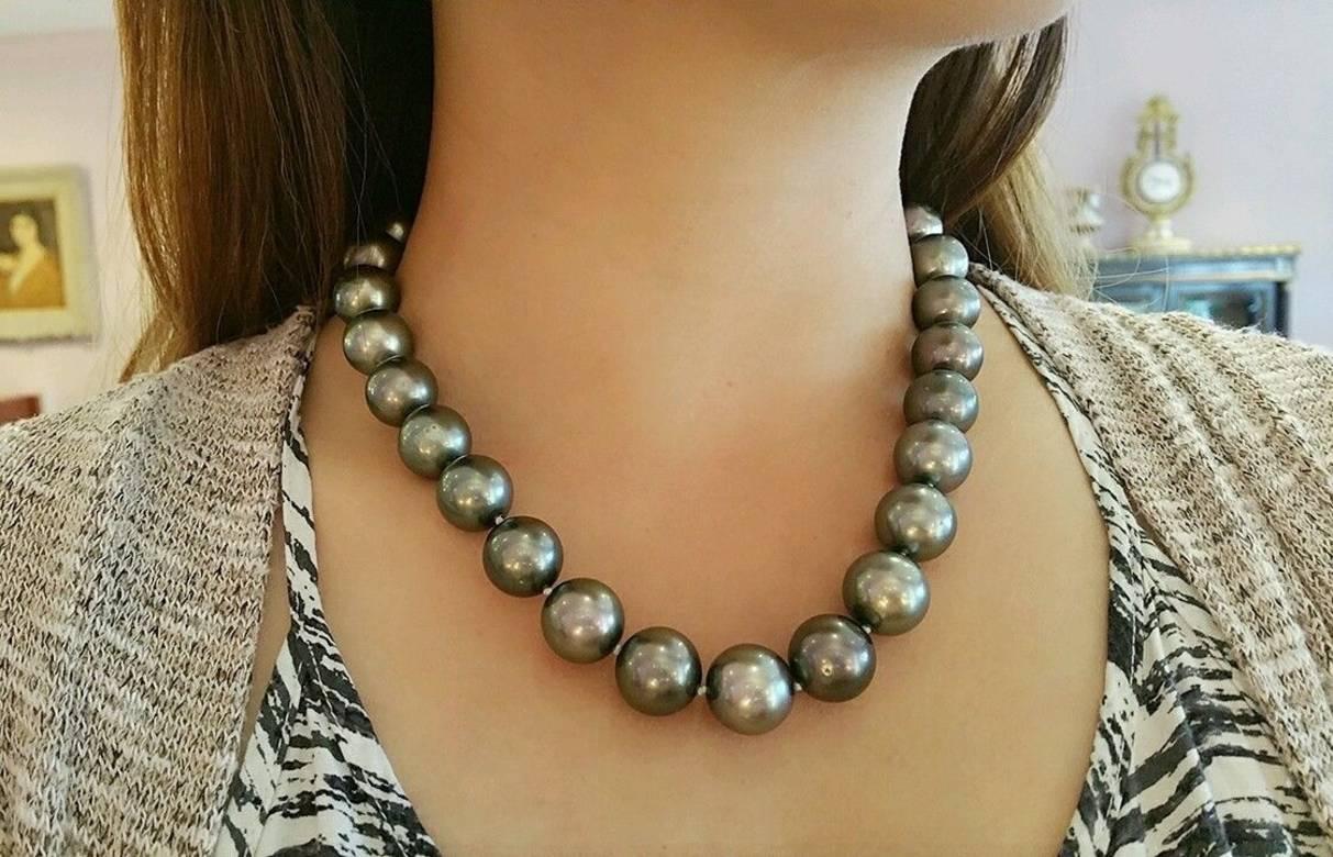Tahitian Black South Sea pearl necklace featuring  29 Round Black South Sea Pearls with minor blemishes, medium to Dark Gray color. The pearls range in size from 16.5mm to 15mm.
Invisible Screw Clasp.
Length is 19 inches