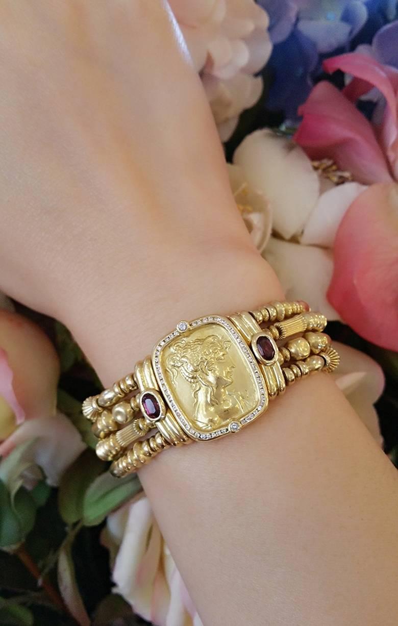 Classic and elegant Seidengang 4-row Beaded Cuff Bracelet with center bas-relief of woman's profile, surrounded by a single row of diamonds. One bezel-set oval Pink Tourmaline on either side.

Fits average size wrist

Hallmarked SG18K 