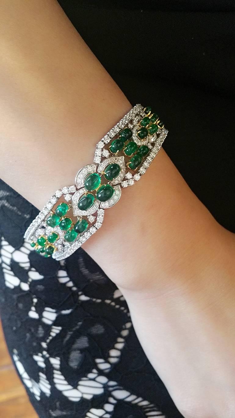 Cabochon Emerald and Diamond Bracelet in 18k White Gold and Yellow Gold
22.22 ct of Dark Green Cabochon Emeralds prong set in 18k Yellow Gold
Surrounded by 10.03 ct of High Quality White Round Brilliant Diamonds set in 18k White Gold

Hallmarked
