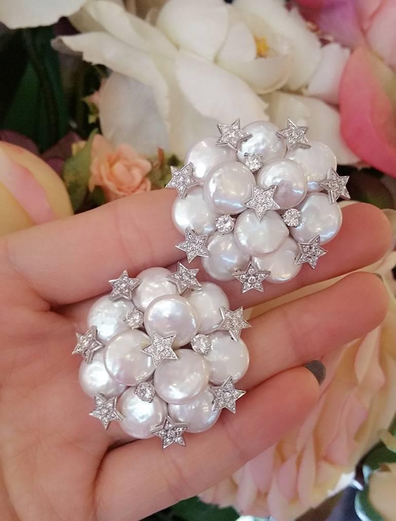 Make a splash with these large and playful Button Pearl Cluster Earrings 
featuring Diamond pave stars and larger diamond accents.

Ten Button Pearls set in a circular design--each pearl is 13 millimeter in size
Beautiful silvery white color and