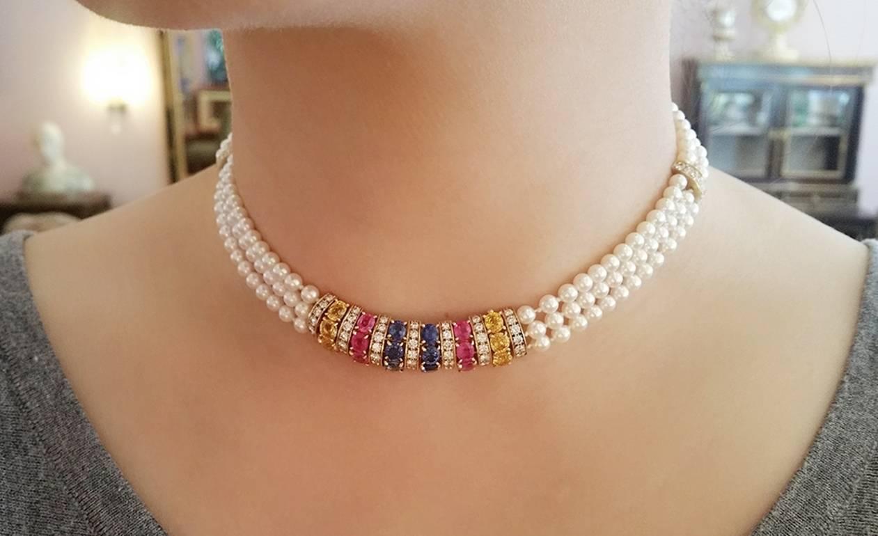 Vintage 18k Yellow Gold VAN CLEEF & ARPELS Pink, Blue, Yellow Sapphire and Diamond Pearl Choker Necklace 

18 Oval Sapphires: 
6 each of Yellow, Pink, and Blue
totaling 9.00 ct estimated

63 Round Brilliant Diamonds
totaling 3.00 ct