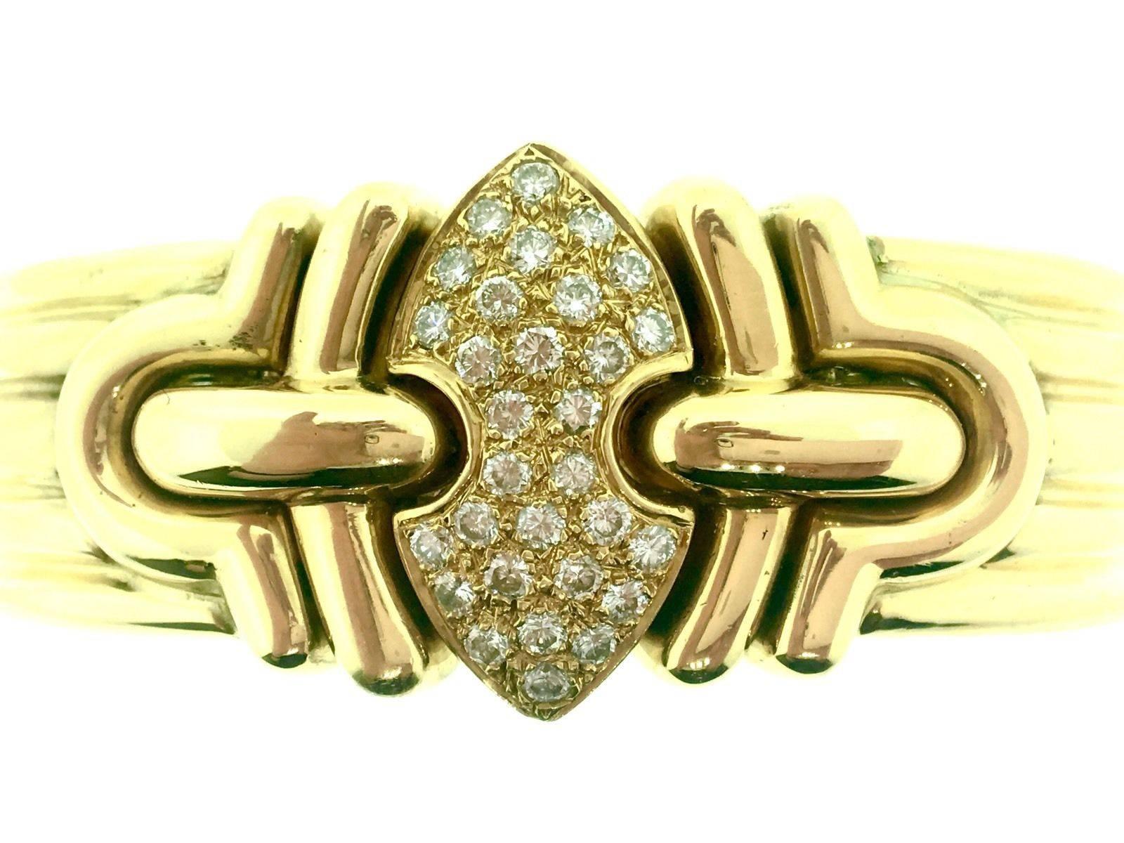 Heavy Cuff Bracelet in 18k Yellow Gold, wide ridged design, with 30 round full cut diamonds in the center of the cuff totaling an estimated 1.60 carats.
Diamond quality is estimated G Color and VS2 Clarity. Unmarked; tested 18k.
Fits normal wrist