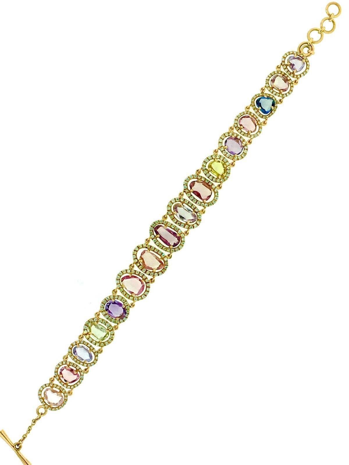 Multicolor Sapphires set with diamond in 18k rose gold. There are 16 rose cut Sapphires varying shapes and colors-- soft hues of pink, purple,  blue and yellow and graduating in size.  Approximately 10 to 12 carats in total.
Surrounding each