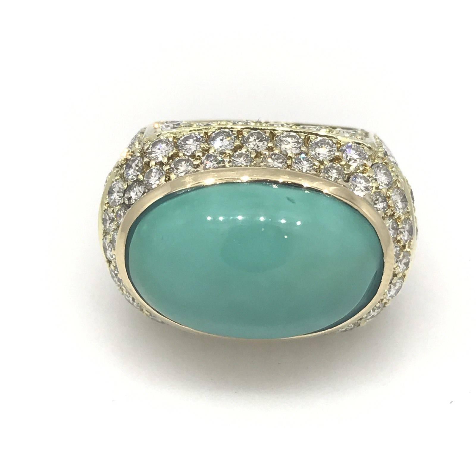 Large Turquoise and Diamond Dome Ring in 18k Yellow Gold featuring
7.50 carats of round brilliant diamonds pave set around the turquoise and on all four sides of the gallery. Diamond quality is VS clarity, G-H color. 
Oval Cabochon Turquoise weighs