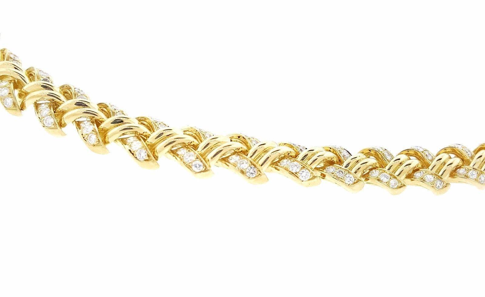 French made diamond choker necklace in 18k yellow gold featuring Round Brilliant Diamonds set in braid style design, graduating in size all the way around the neck. Total carat weight is 10.00 cts. Round Diamonds, VS2-SI1 clarity, G-H color.