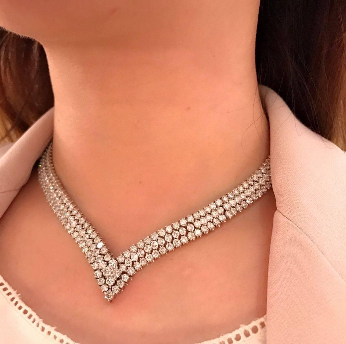 Fine quality diamond choker necklace with three rows of diamond and V-shaped, set in Platinum. There are a total of 41.25 carats of round brilliant diamonds, VS in clarity and H in color. Center row of diamonds is slightly larger than outer rows.
