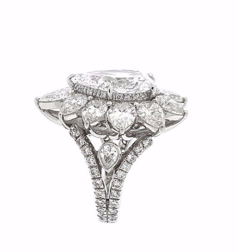 Gorgeous diamond cocktail ring in Platinum containing 5.14 ct Pear Brilliant diamond center, D color and SI1 clarity, with GIA Certification (* please see copy of GIA certification in photo gallery). 
Set in Platinum, with Eleven (11) Large Pear