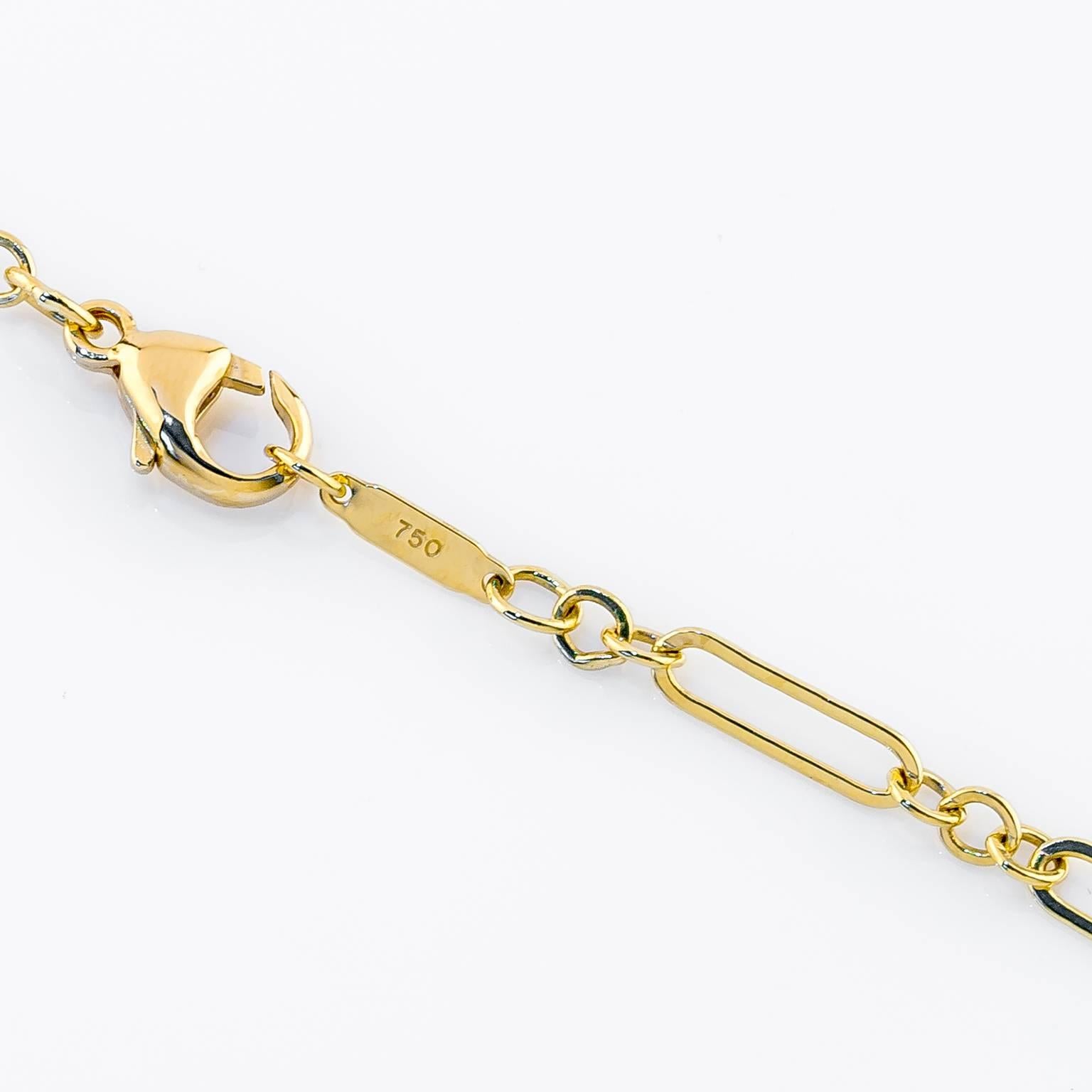 Beautifully simple 18kt gold heart charm drops from an unique chain link necklace crafted from solid 18k yellow gold. 

Heart 1.25in (3.175 cm) x 1.375in (3.492cm) Chain 26.25in L (66.675cm)
Marked Tiffany & Co.