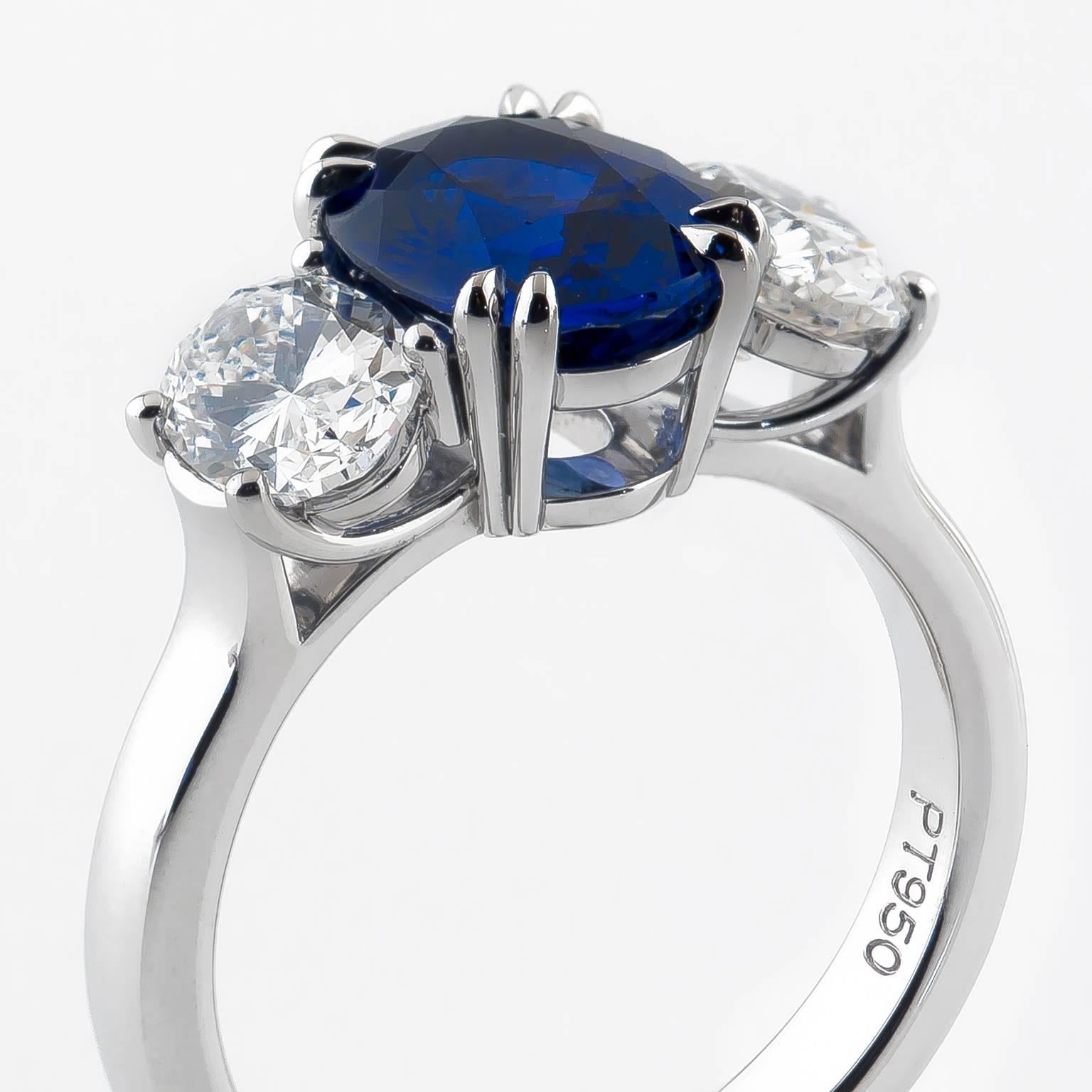 Expertly hand fabricated. Classic in platinum. This ring is centered around an outstanding natural Madagascar sapphire of exceptional color = 2.31 Carats, flanked by two oval diamonds of VS clarity & weighing 1.385 Cttw.
Size 6
2.31 carat Sapphire