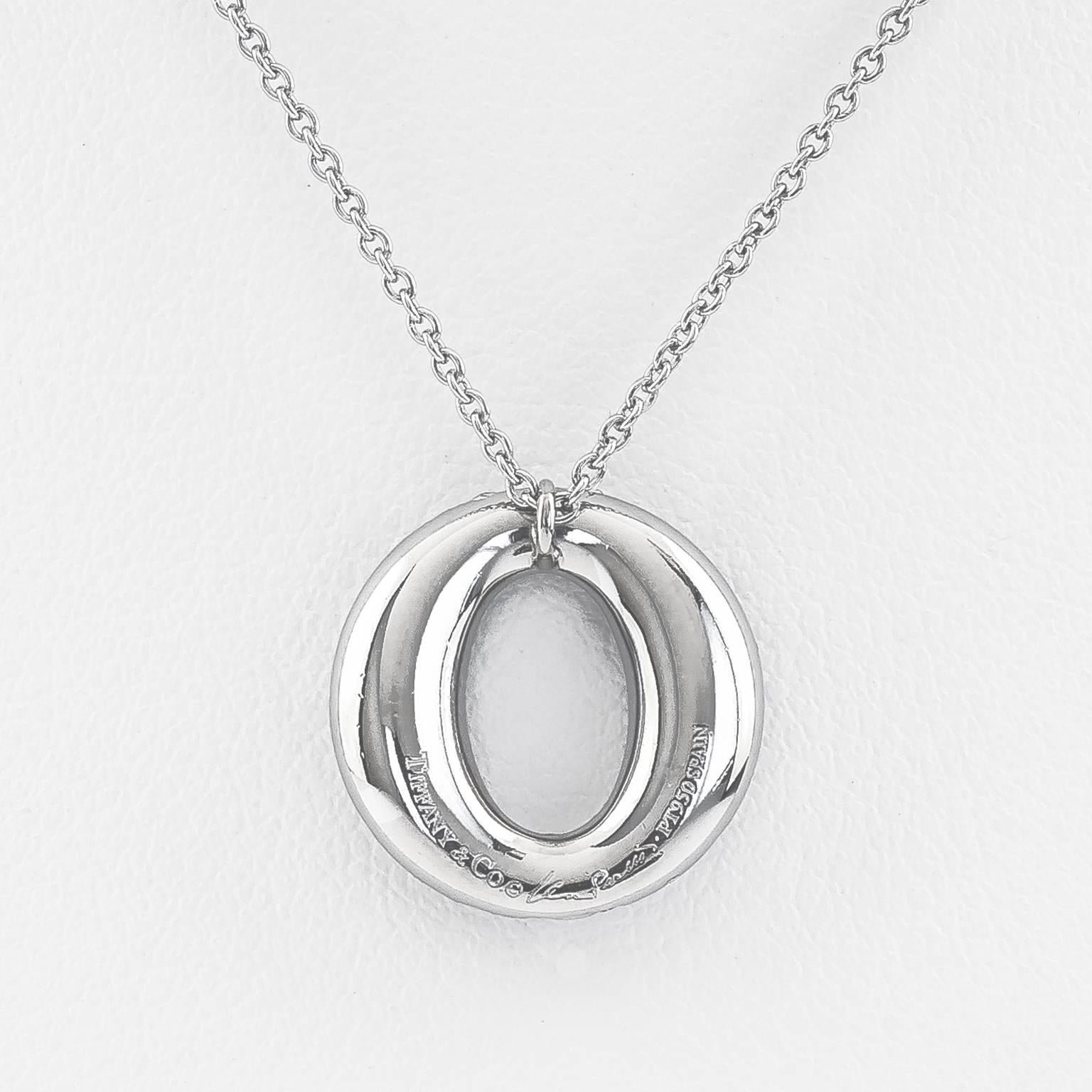 Elsa Peretti’s iconic elliptical form pendant of pavé diamonds set in platinum hangs from a 16 in Platinum chain.
Pendant 55 dia. 0.75 cttw Diamonds F-G VS
Marked: Tiffany & Co. Elsa Peretti PT 950 Spain.