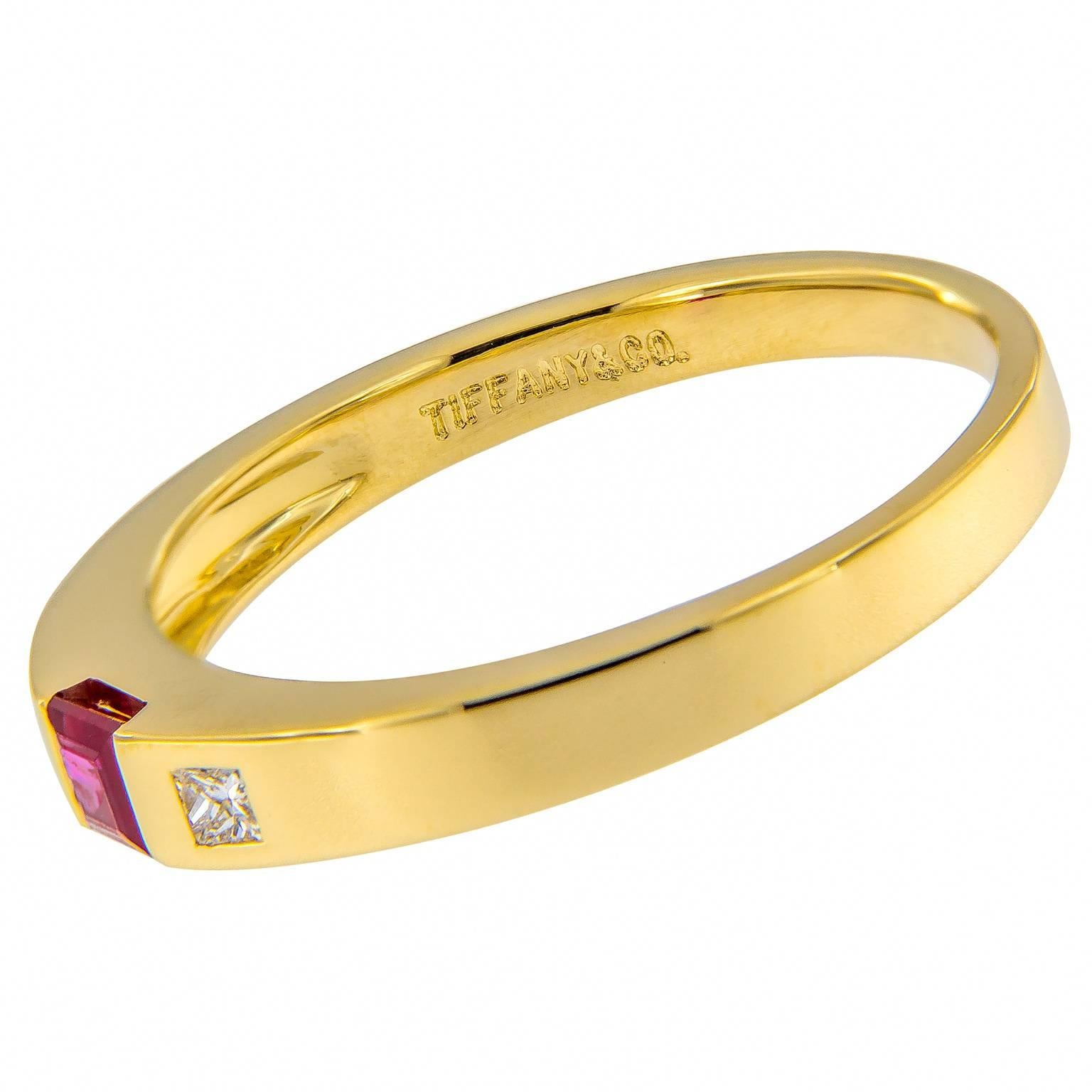 This lovely 18k yellow gold Tiffany & Co. ring features center ruby accented with two diamonds. Ring Size 9.25. 3 mm at the top, tapering to 2 mm

Ruby .25 ct est.
Diamonds .10 cttw est.

Marked Tiffany & Co.