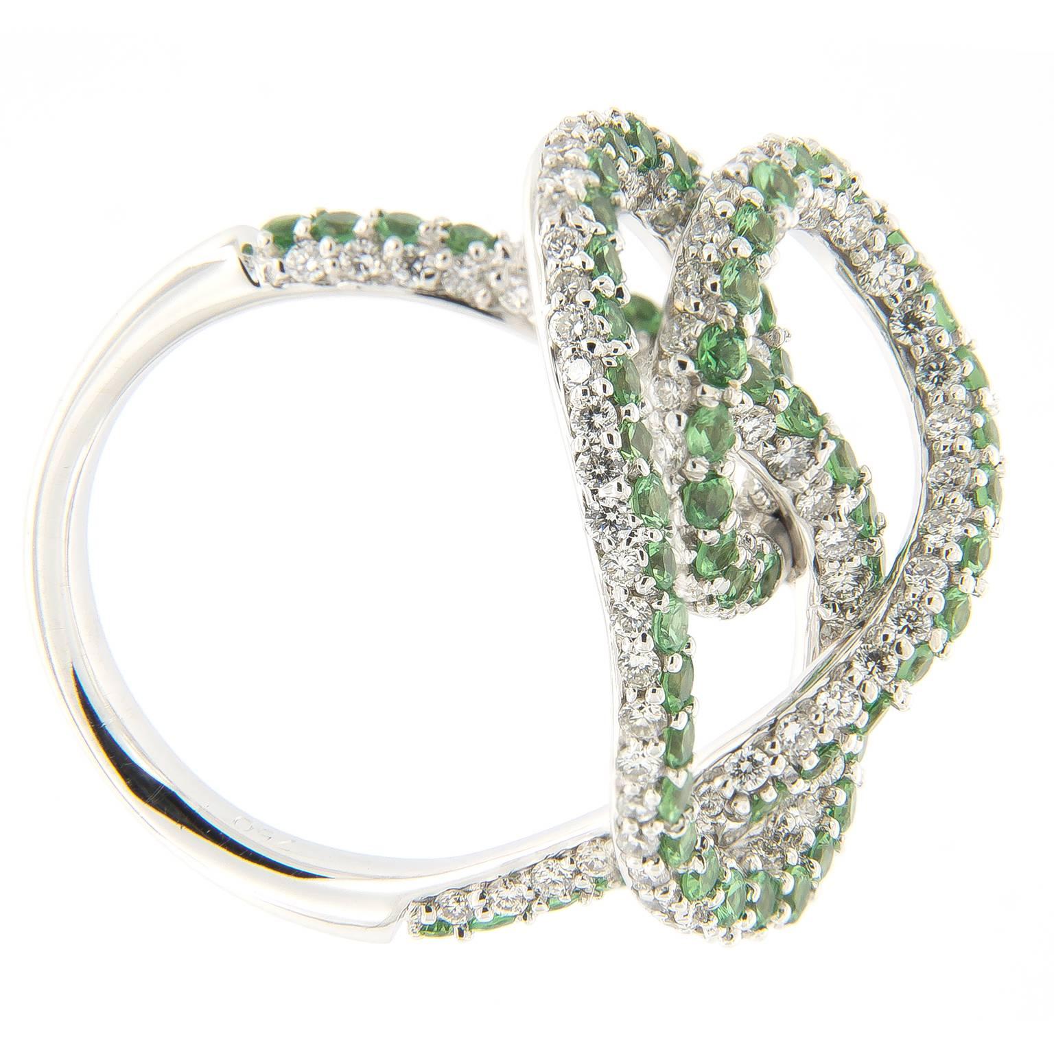 Whimsical 18k white gold large swirl knot ring from Hammerman of New York is compromised of 161 round diamonds and 69 savorites.
Ring Size 6.25

RBC Diamonds 1.49 cttw
Savorites 1.33 cttw
