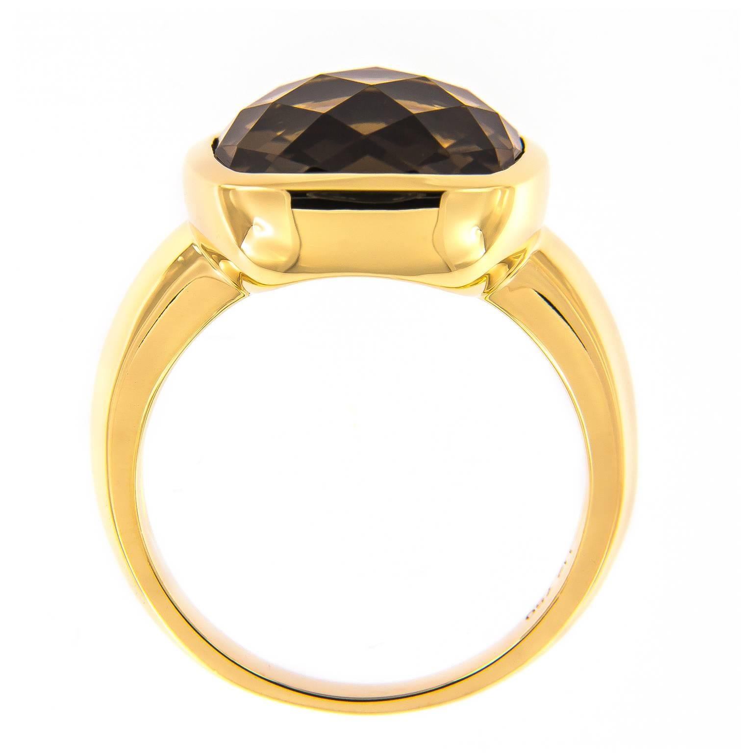Dramatic and rich, this fashion ring from the H2 Collection by Hammerman of New York is a luxe choice. The checkerboard cushion cut topaz is set in 18k yellow gold. Ring Size 6.25

Smoky Topaz 8.65 carat.