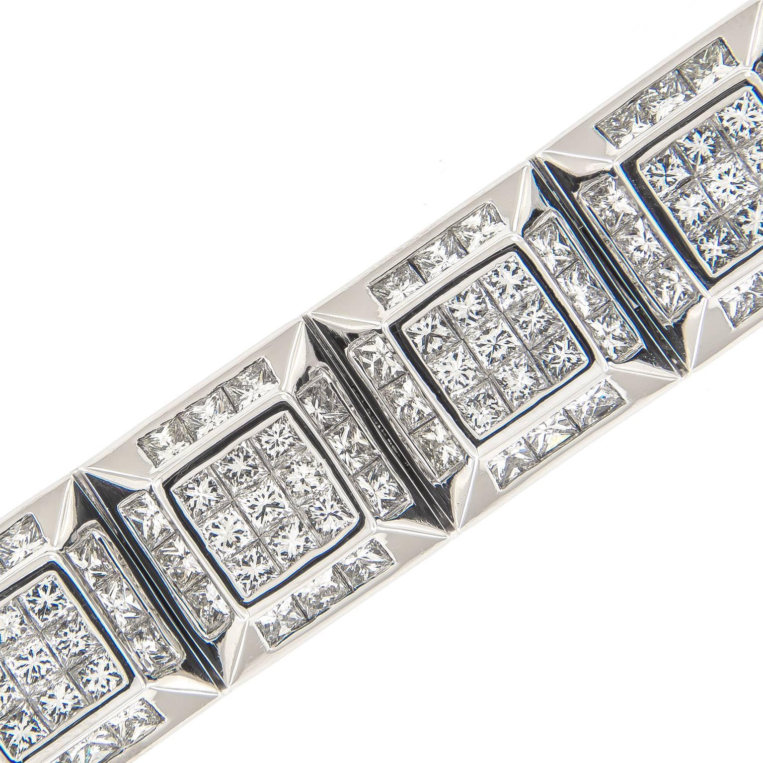 Striking diamond bracelet is a masterpiece of luxury and fashion. 19.74cttw of diamonds set in 18k white gold ice-cube link design. Weighs 75.4 grams. 
Length 7.25 in (18.415)
Diamonds 19.74cttw. VS2/SI2 GH